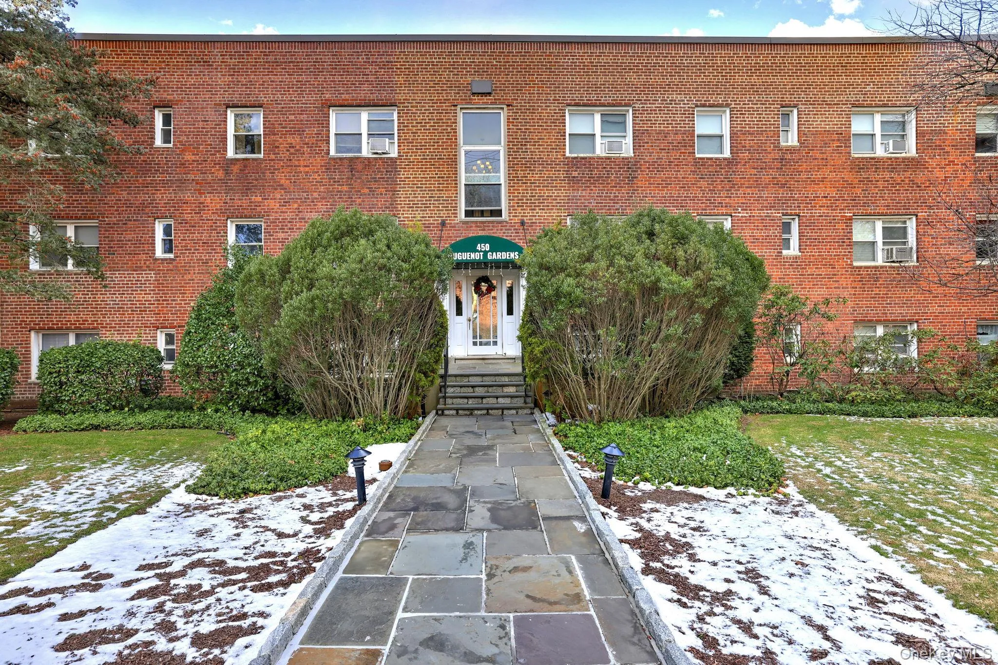 Snow covered property with a view of apartment building / complex Snow covered property with a view of apartment building / complex