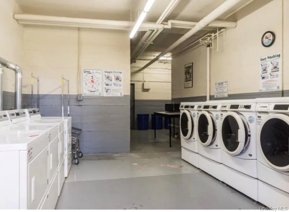Communal laundry room with independent washer and dryer Communal laundry room with independent washer and dryer