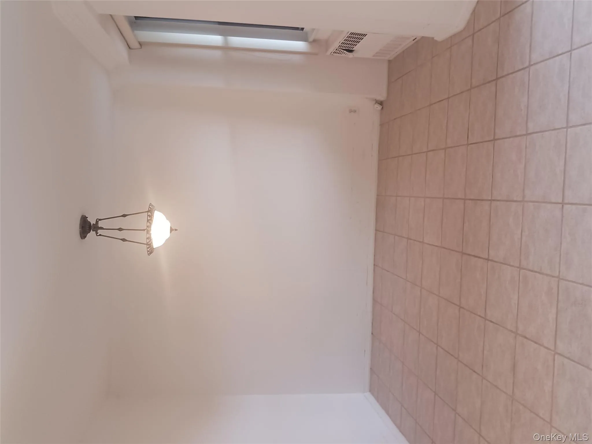 Sleeping Alcove Unfurnished room featuring light tile patterned floors and radiator Sleeping Alcove Unfurnished room featuring light tile patterned floors and radiator