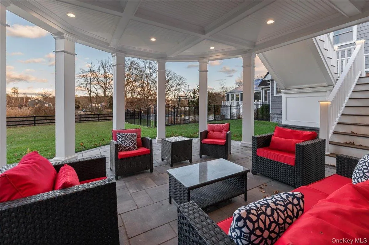 Sunroom / solarium with outdoor lounge area, a patio, beamed ceiling, and coffered ceiling Sunroom / solarium with outdoor lounge area, a patio, beamed ceiling, and coffered ceiling