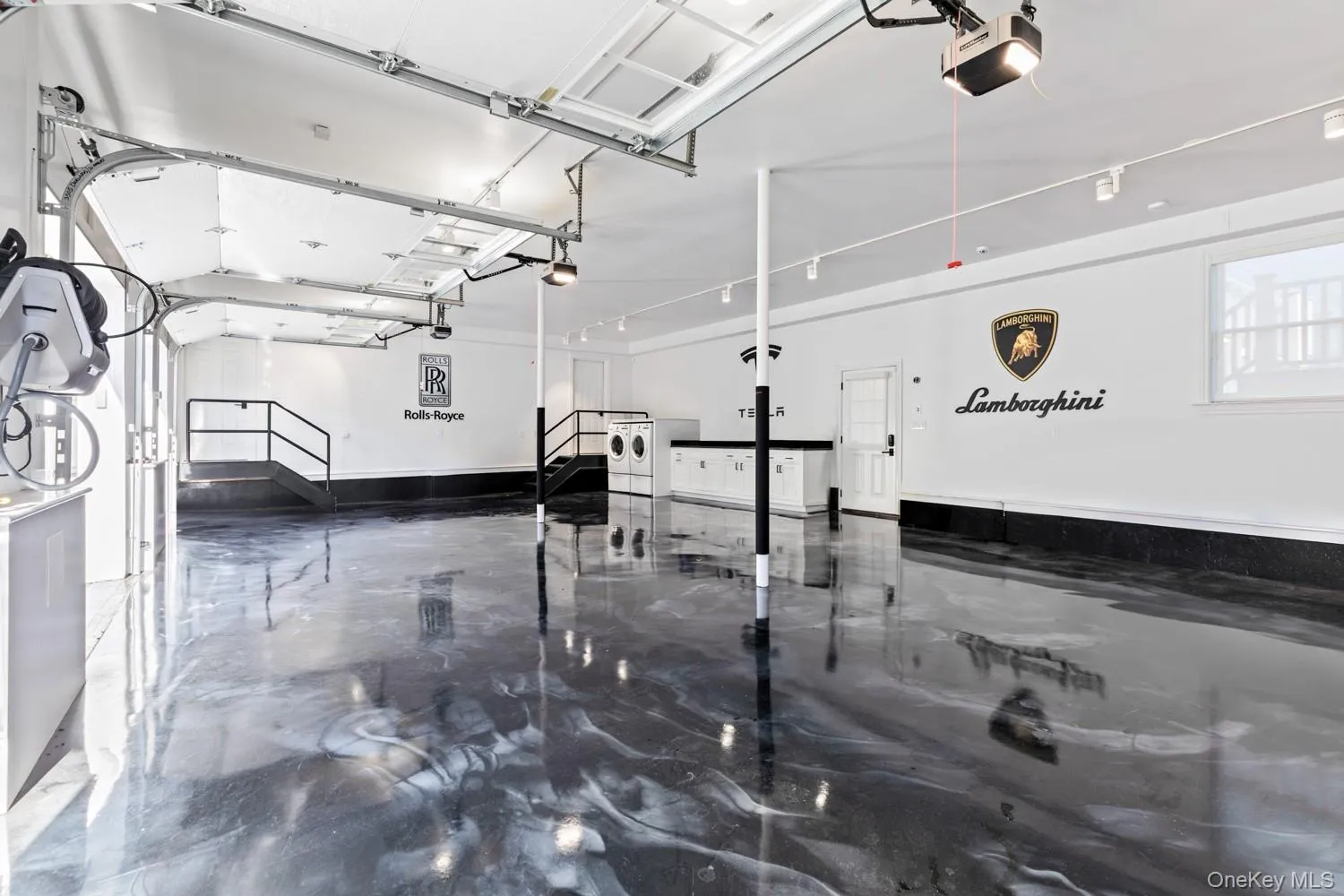 Garage with a garage door opener and independent washer and dryer Garage with a garage door opener and independent washer and dryer