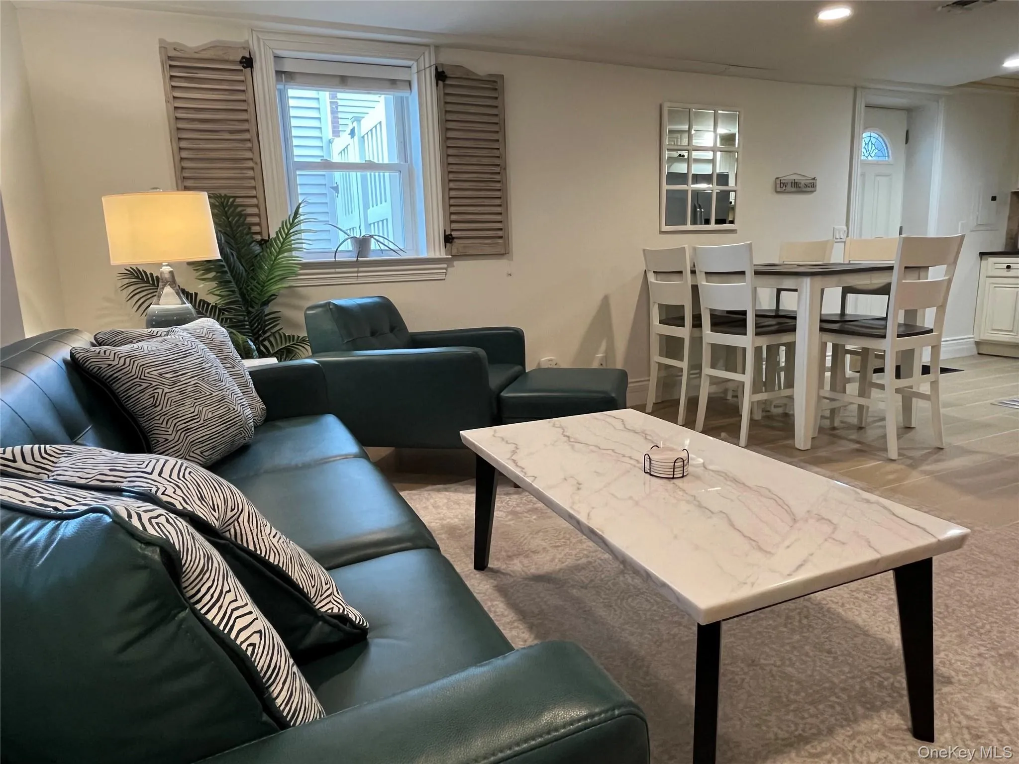 Living room featuring light wood-type flooring and recessed lighting Living room featuring light wood-type flooring and recessed lighting