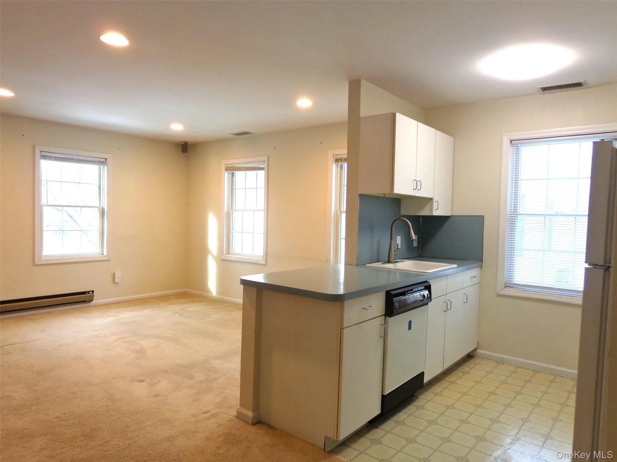 Additional view of kitchen and living room Additional view of kitchen and living room