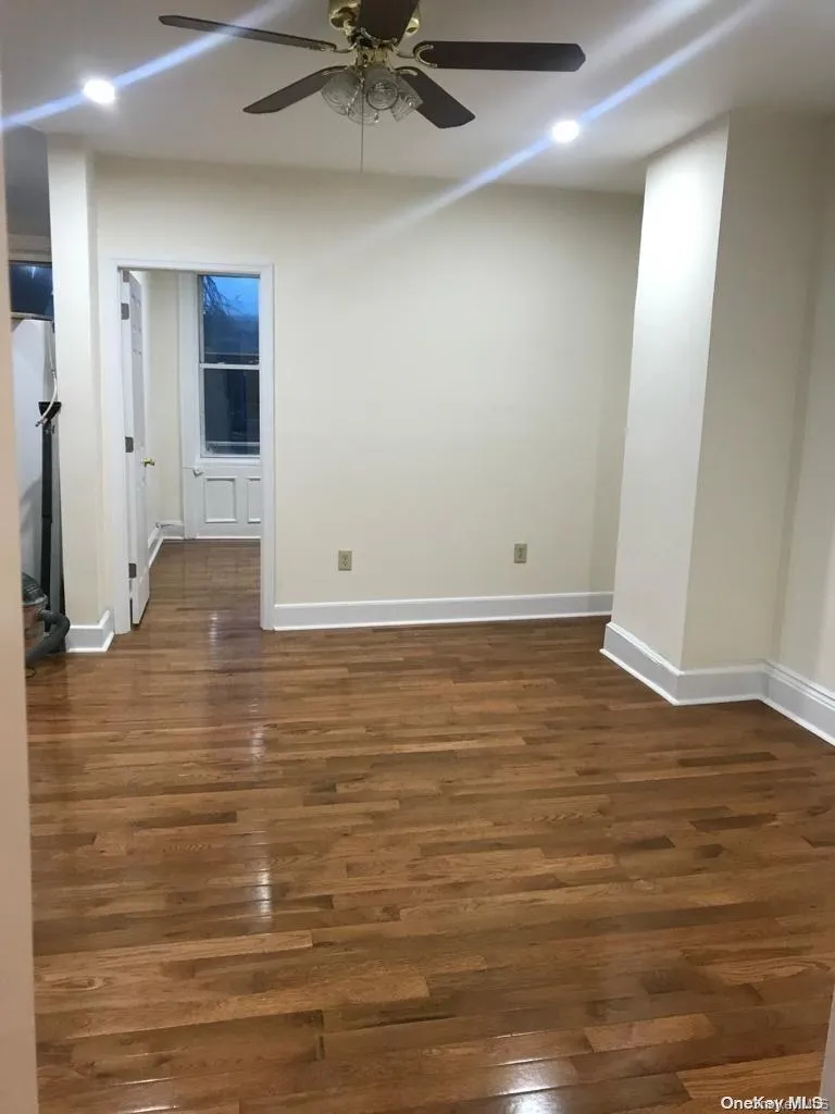Unfurnished room with recessed lighting, dark wood finished floors, and ceiling fan Unfurnished room with recessed lighting, dark wood finished floors, and ceiling fan
