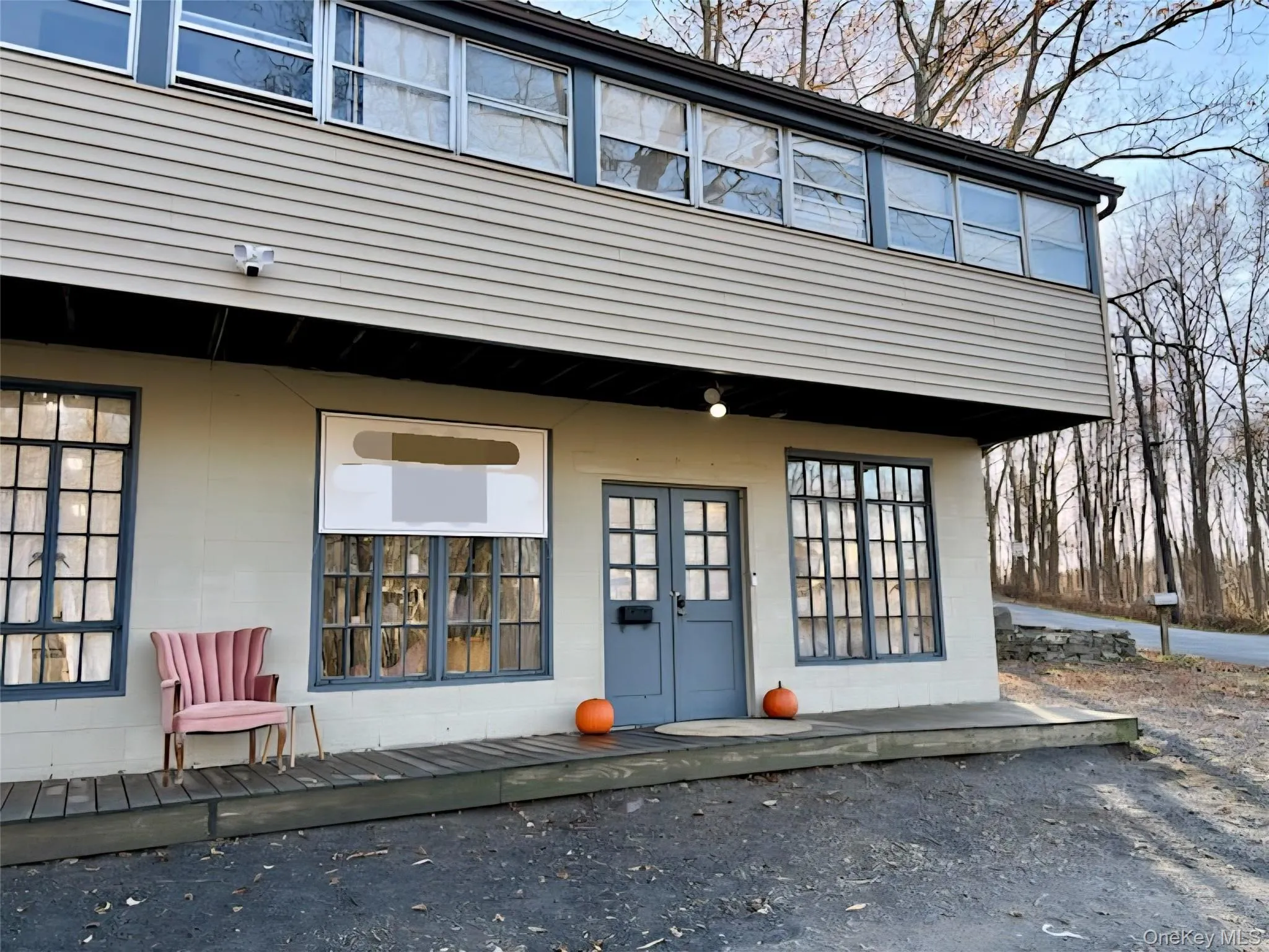 Doorway to property with a deck and concrete block siding Doorway to property with a deck and concrete block siding