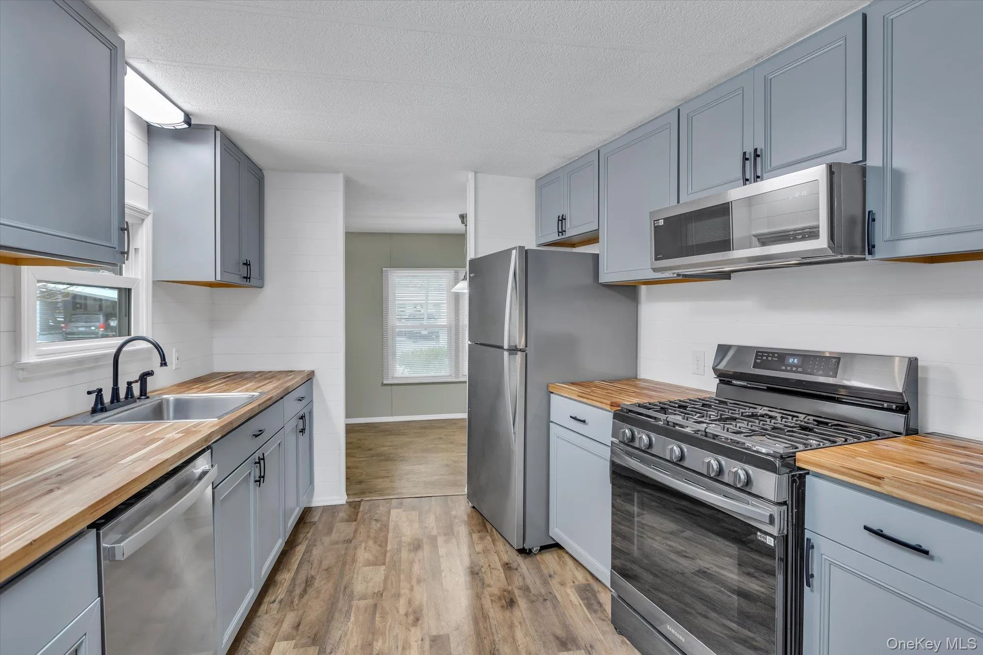 Kitchen, with new appliances, cabinets, counters, lighting Kitchen, with new appliances, cabinets, counters, lighting