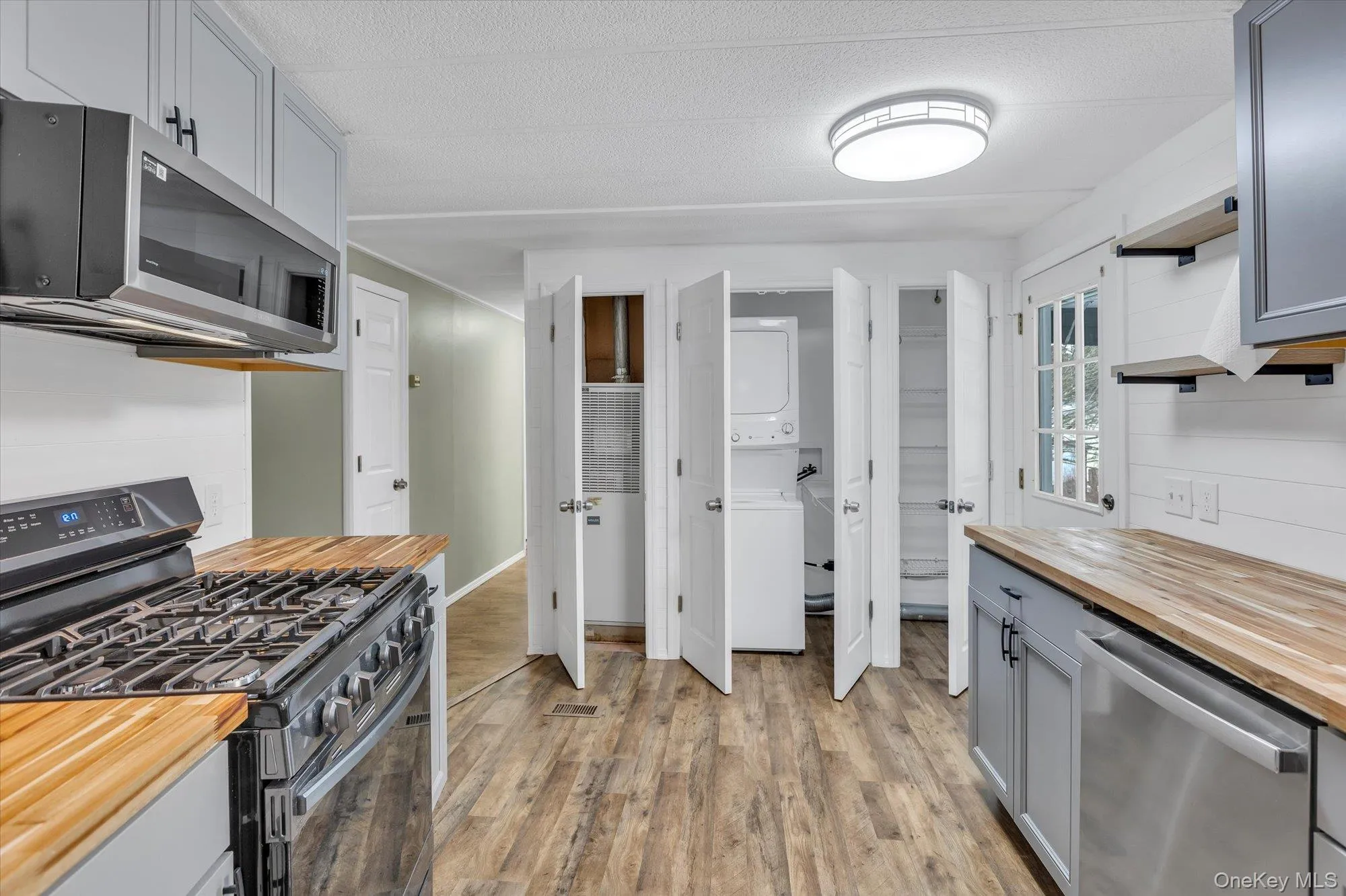 Kitchen, with new appliances, cabinets, counters, lighting, and washer/dryer, pantry Kitchen, with new appliances, cabinets, counters, lighting, and washer/dryer, pantry