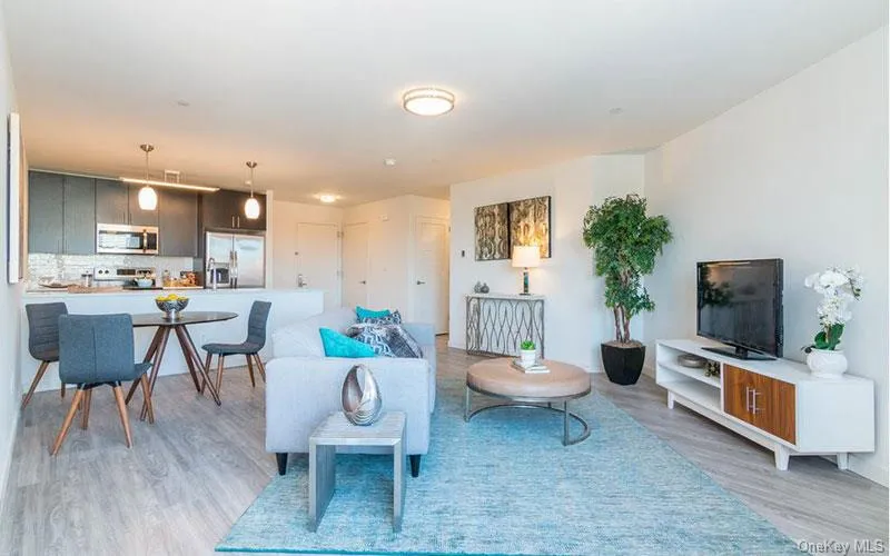 Living room featuring light wood-style flooring Living room featuring light wood-style flooring