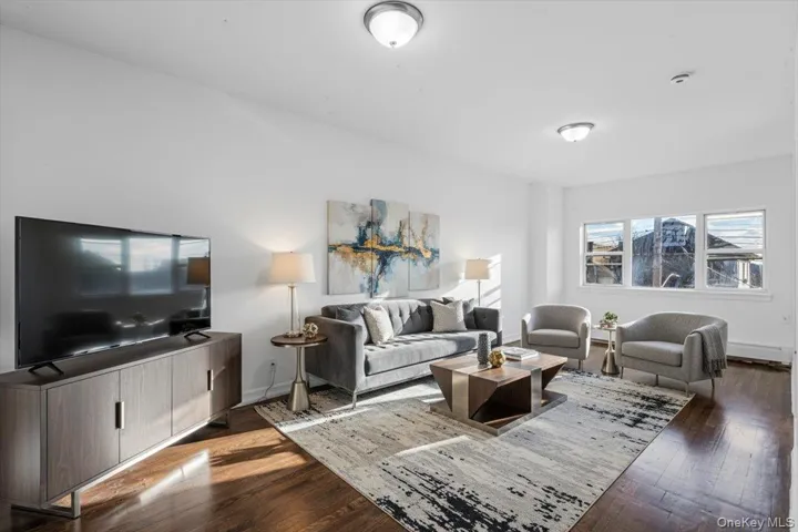 Living area featuring dark wood-style flooring
