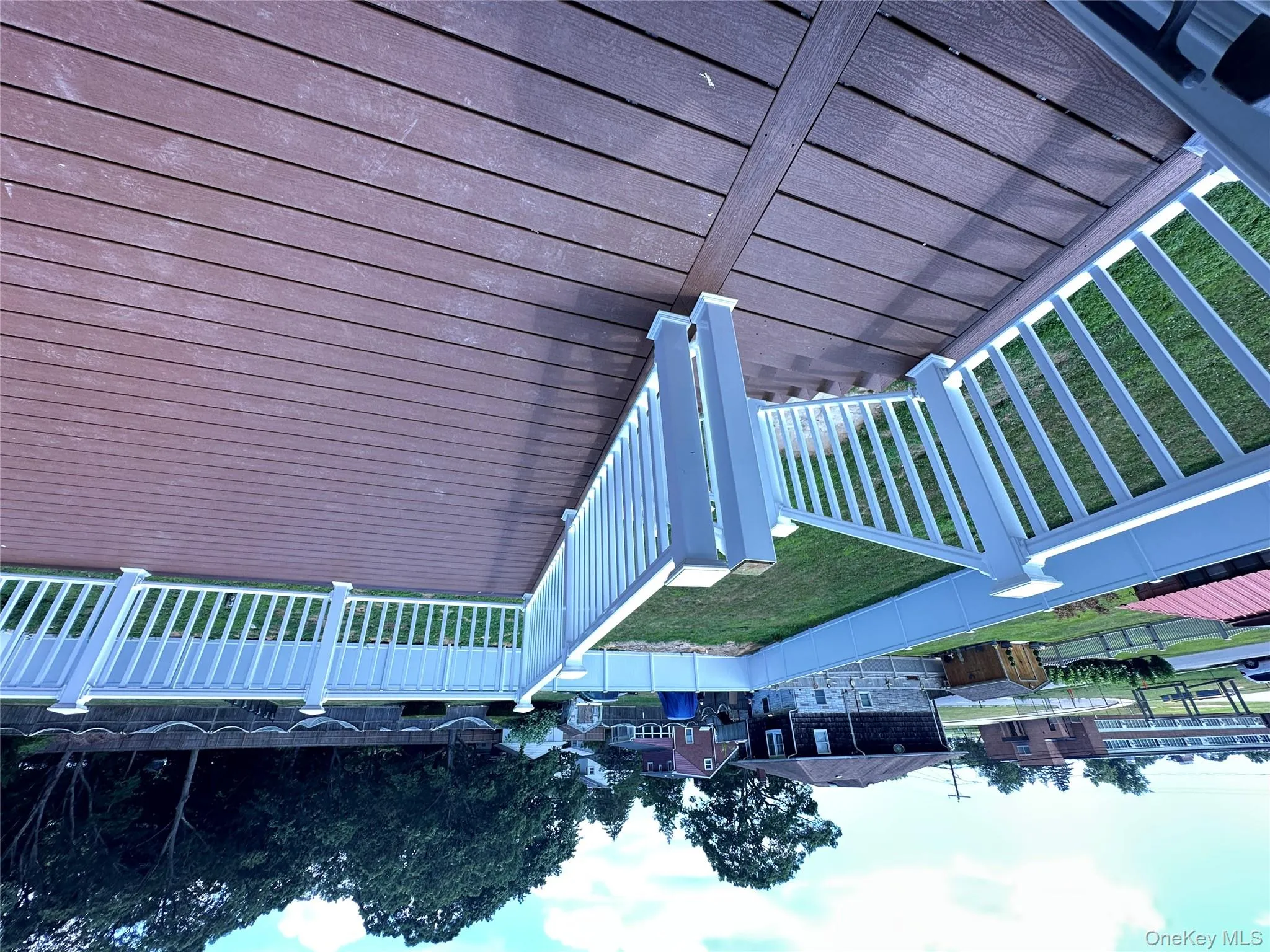 Deck with a fenced backyard and a residential view Deck with a fenced backyard and a residential view