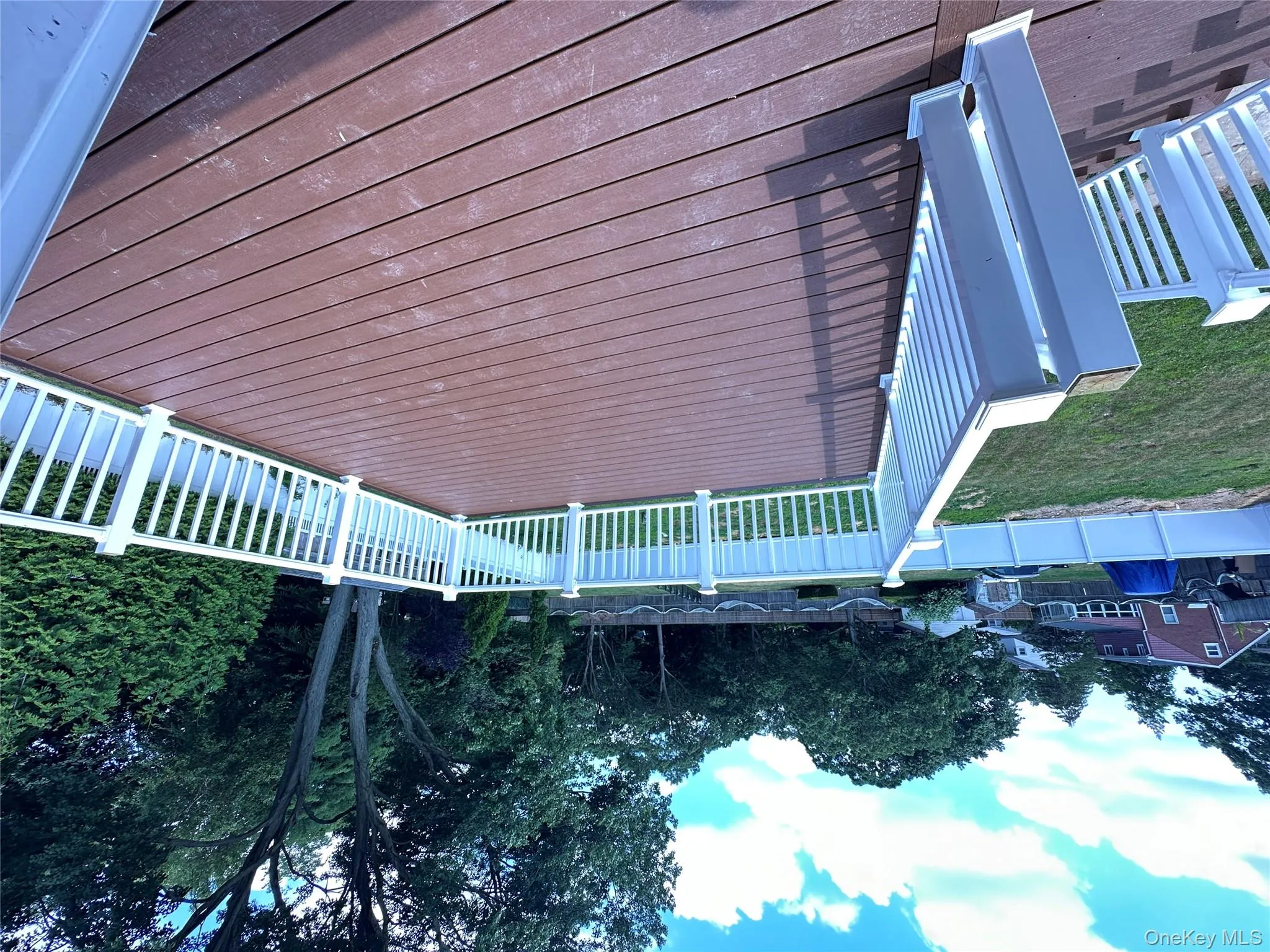 Wooden deck featuring a fenced backyard Wooden deck featuring a fenced backyard