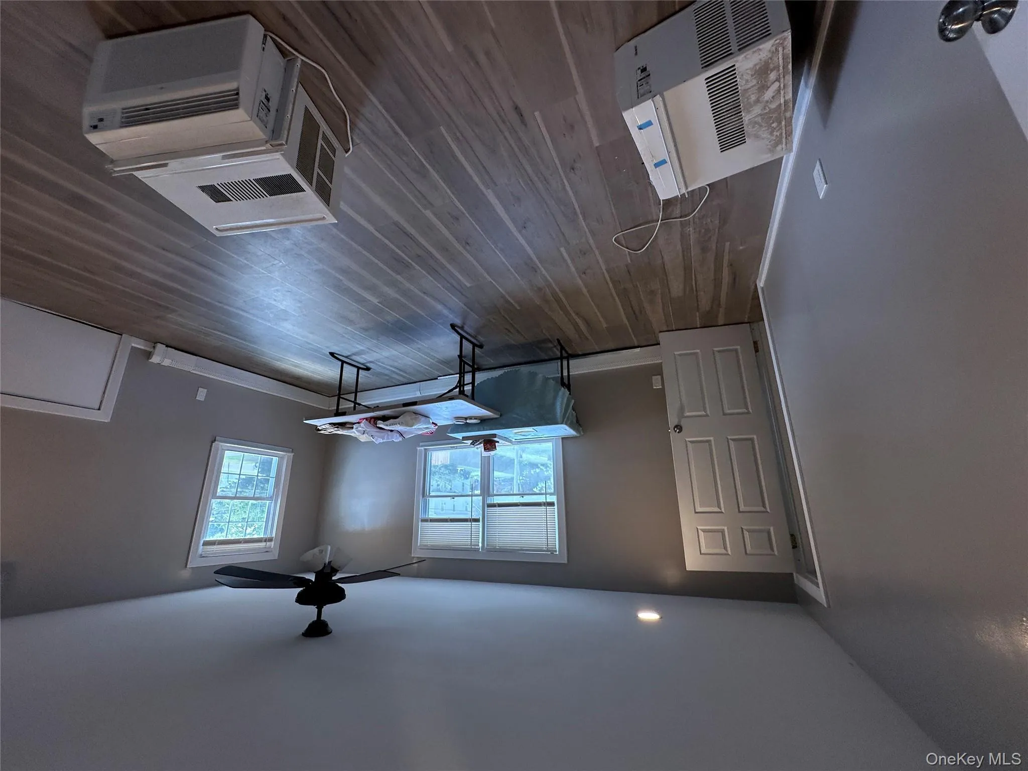 Office space with dark wood-style floors, recessed lighting, a wall unit AC, and ceiling fan Office space with dark wood-style floors, recessed lighting, a wall unit AC, and ceiling fan