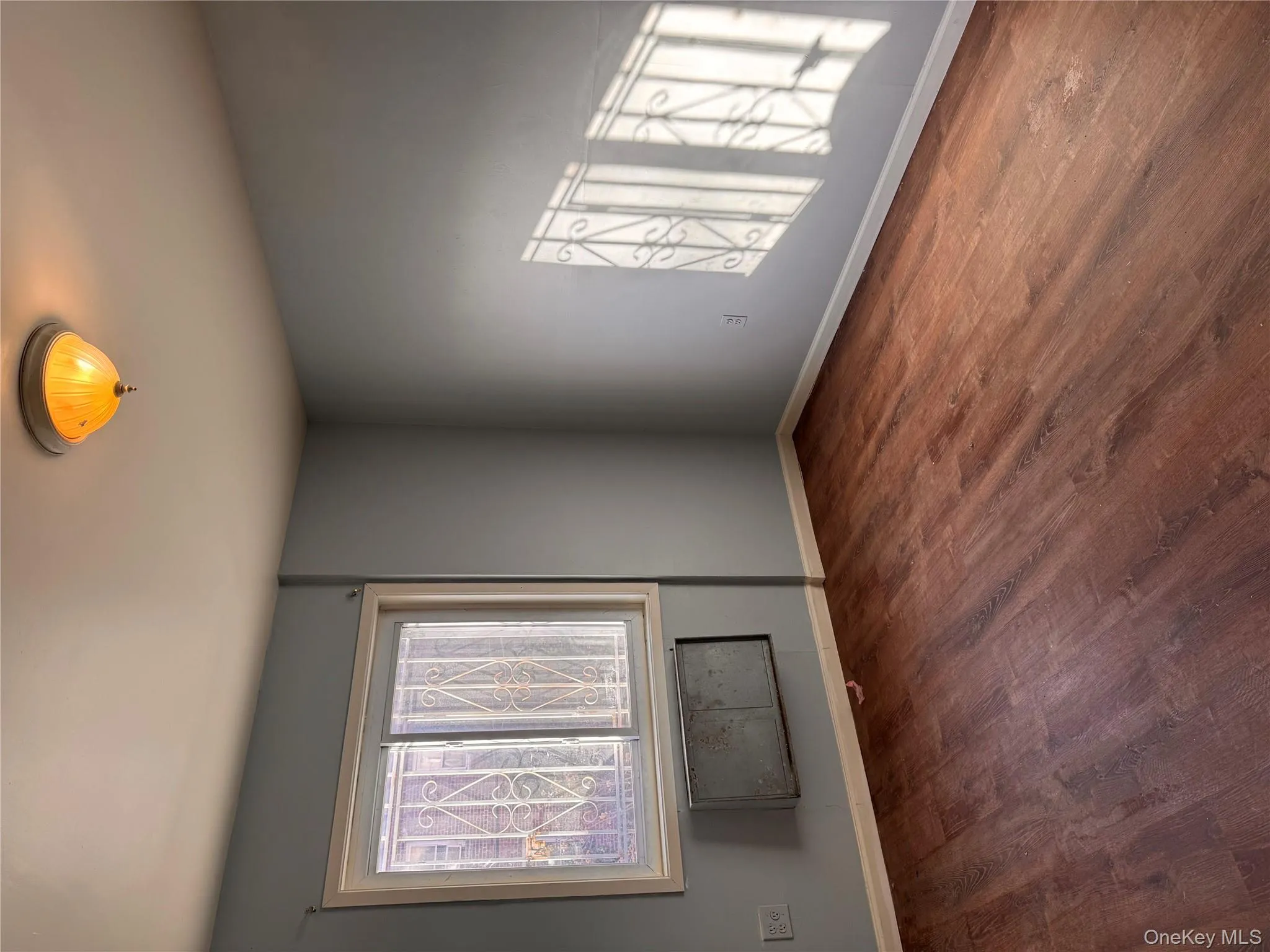 Empty room with wood finished floors and baseboards Empty room with wood finished floors and baseboards