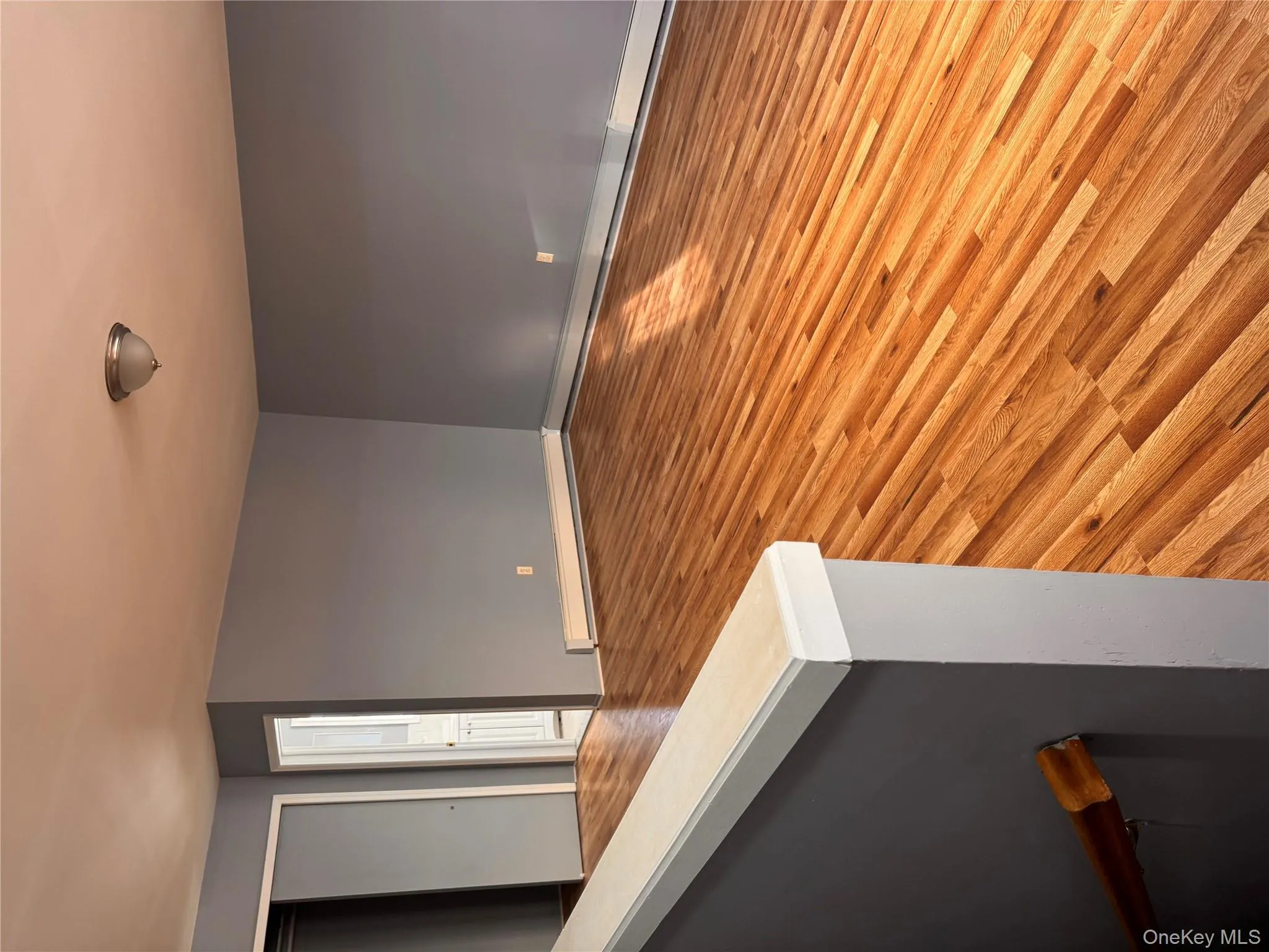 Unfurnished room featuring light wood-style flooring and a baseboard heating unit Unfurnished room featuring light wood-style flooring and a baseboard heating unit