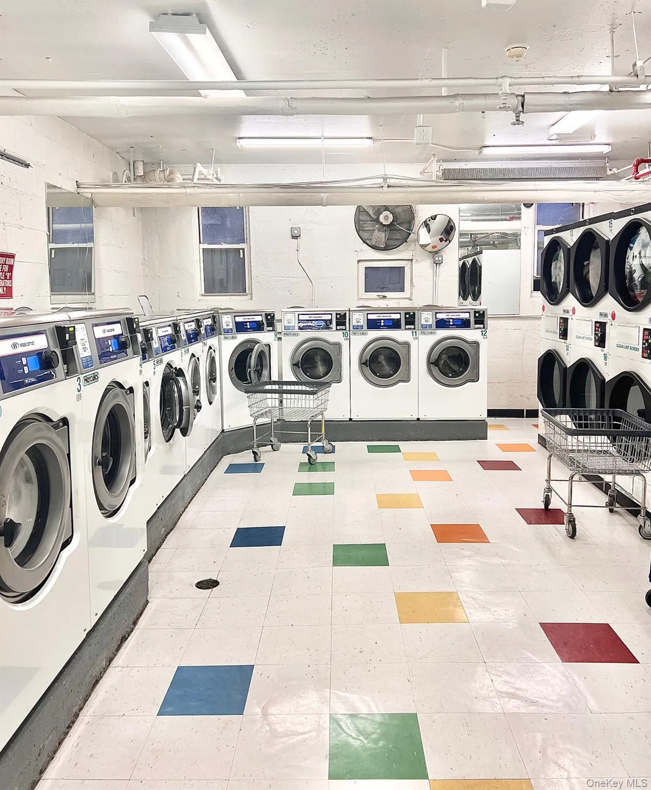 Community laundry with washer and clothes dryer Community laundry with washer and clothes dryer