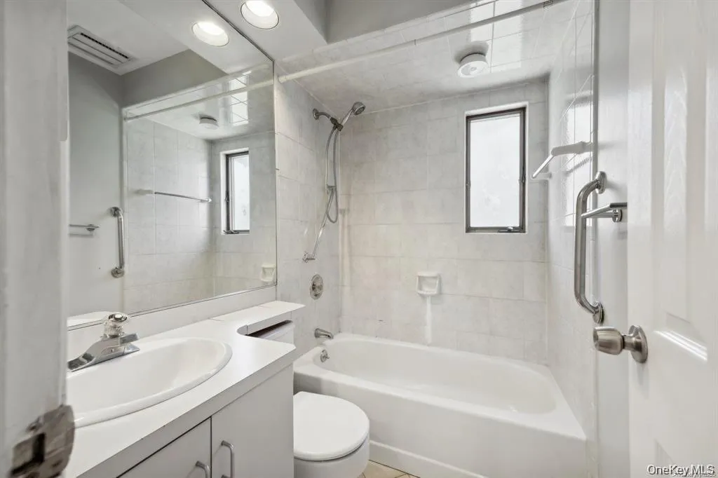 Full bathroom with vanity, tub / shower combination, and recessed lighting Full bathroom with vanity, tub / shower combination, and recessed lighting