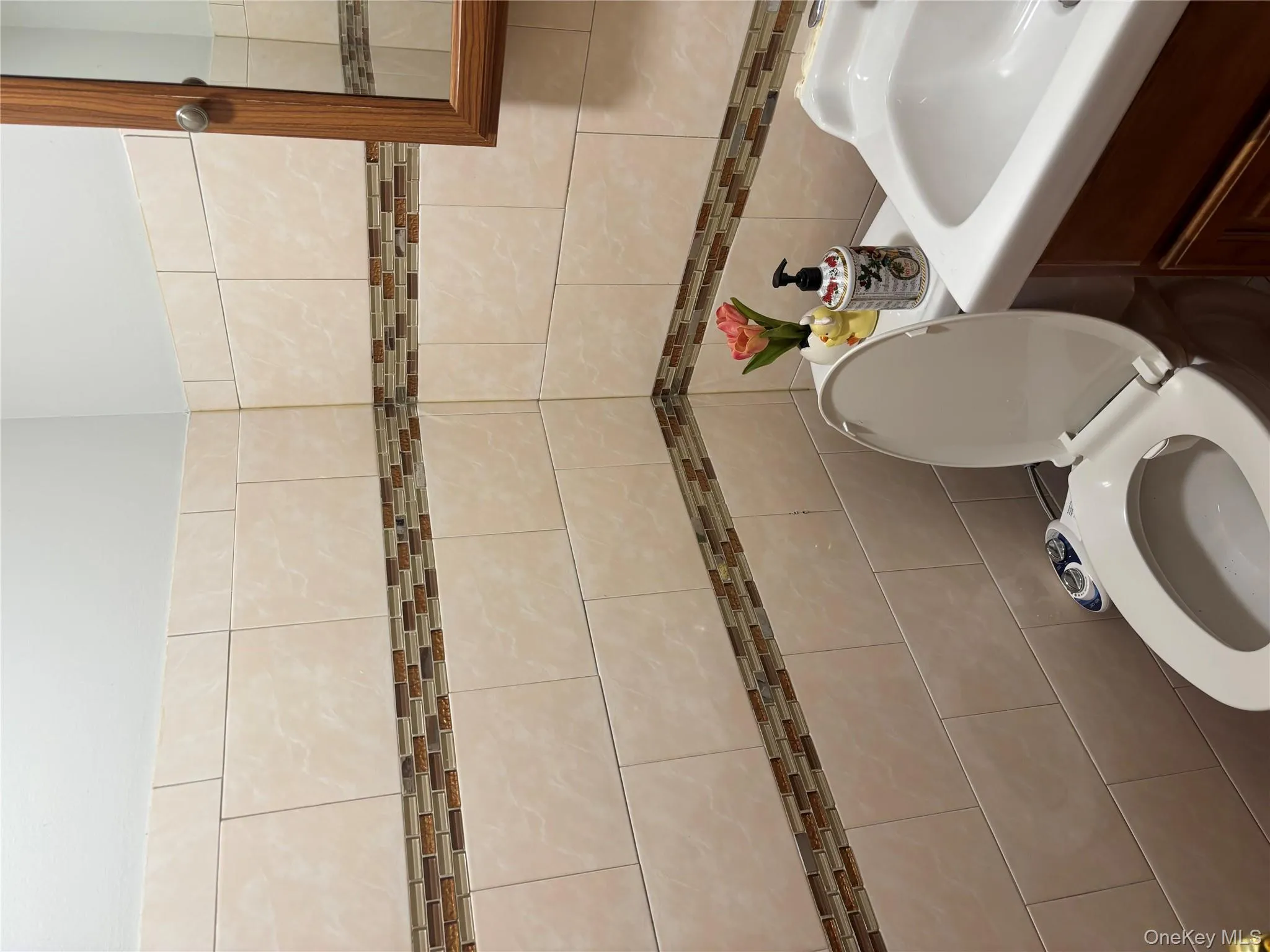 Half bathroom with vanity and tile walls Half bathroom with vanity and tile walls