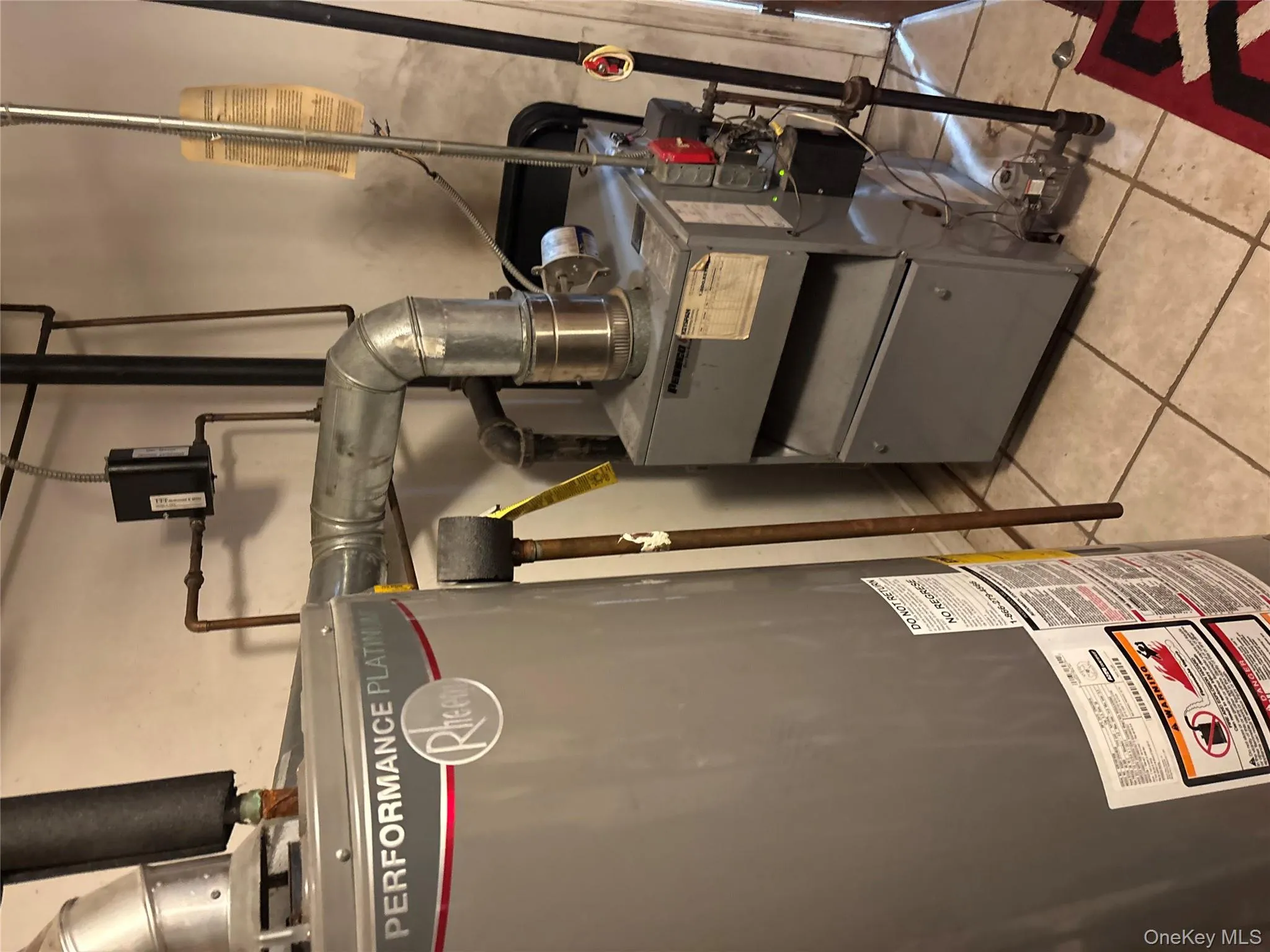 Utilities with water heater and a heating unit Utilities with water heater and a heating unit