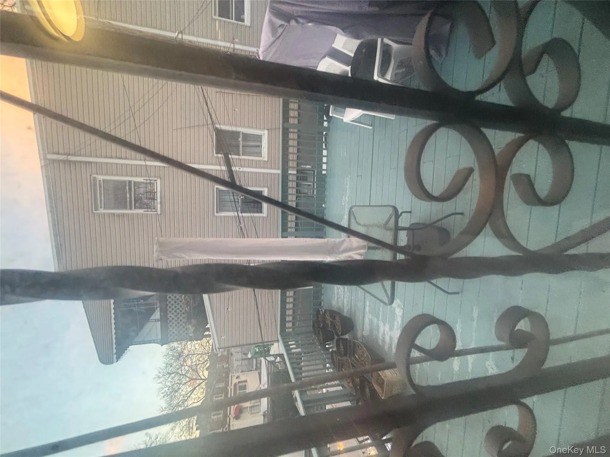 View of pool featuring a balcony View of pool featuring a balcony