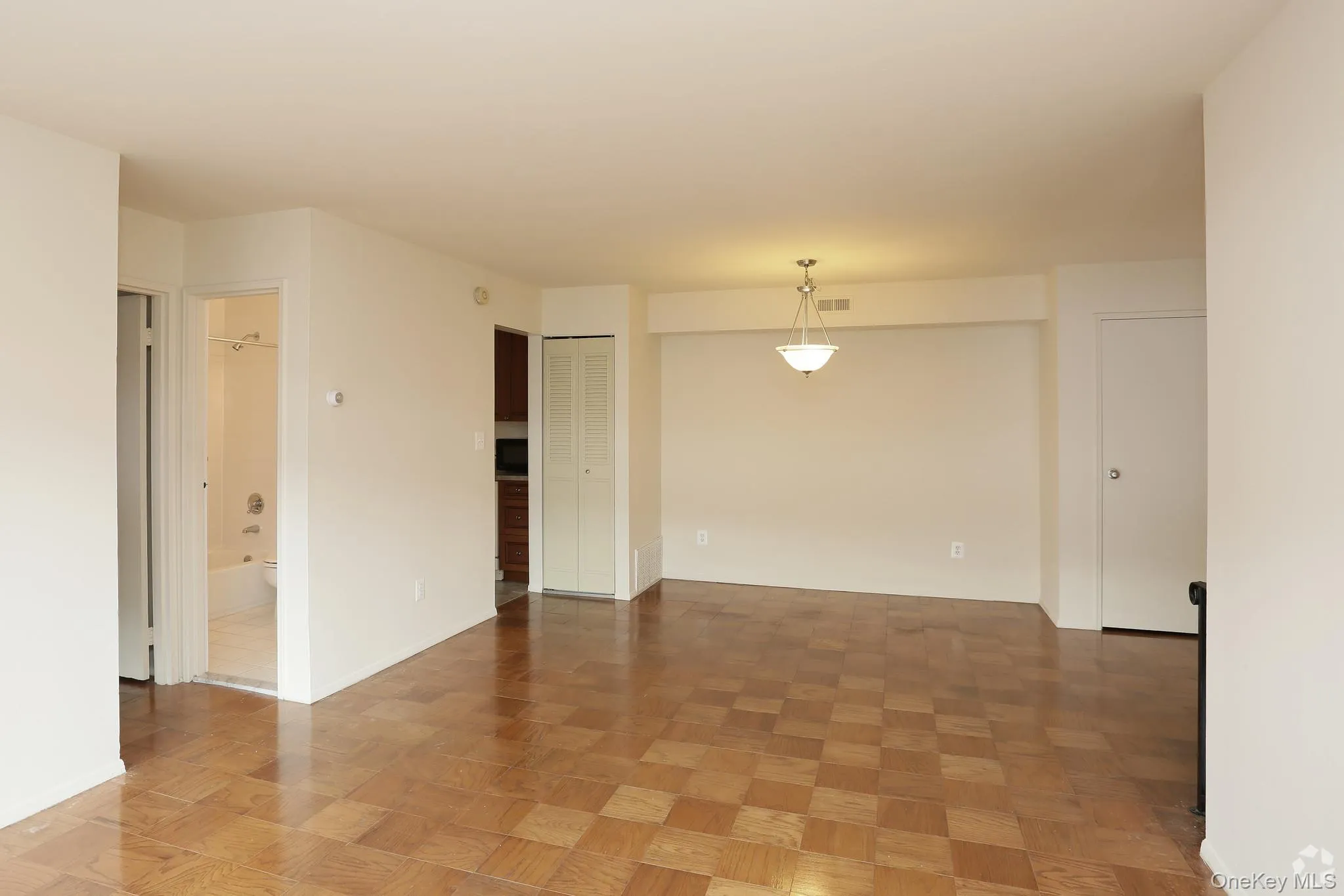 Unfurnished room with baseboards Unfurnished room with baseboards