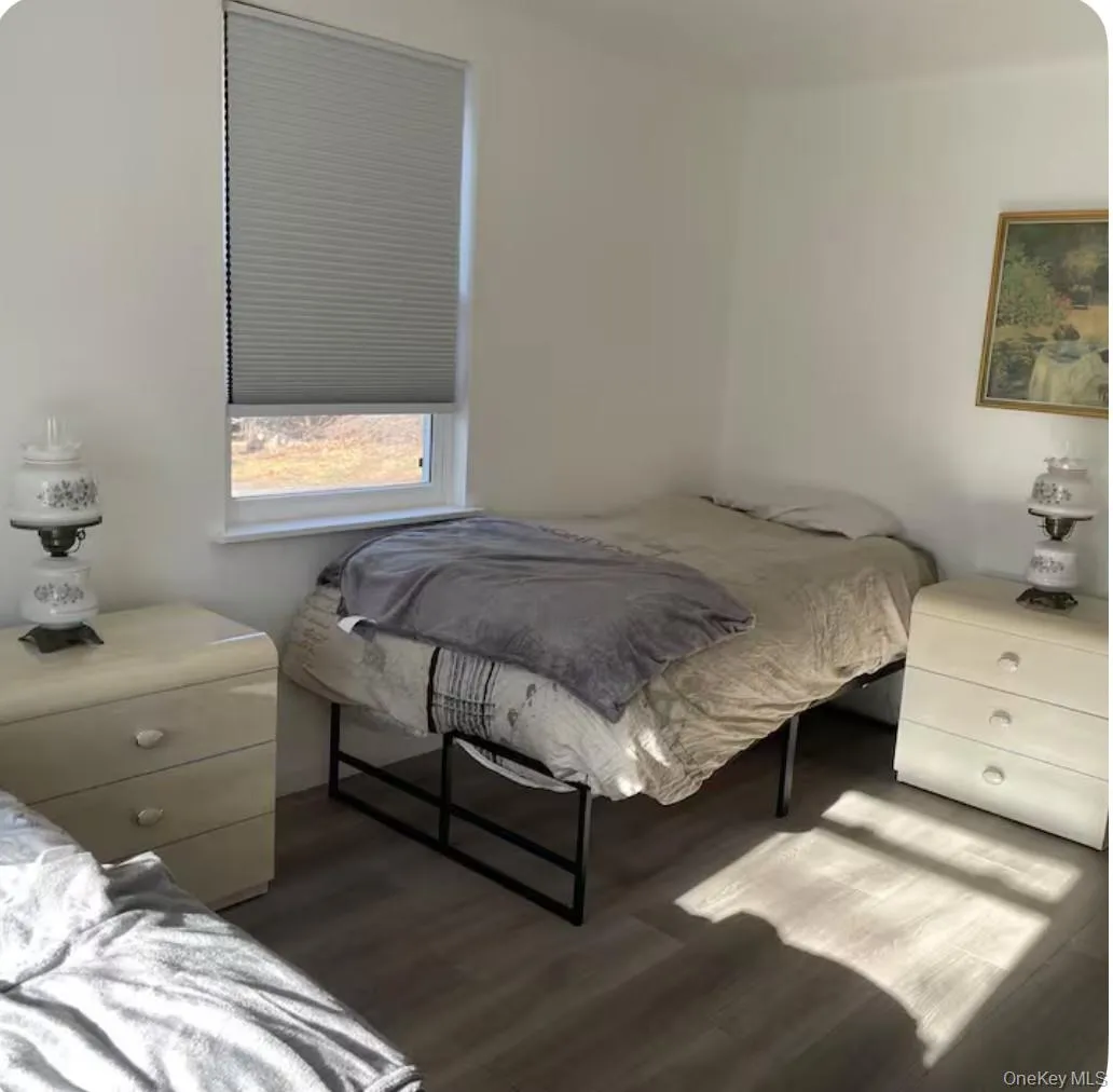 Bedroom with wood finished floors Bedroom with wood finished floors