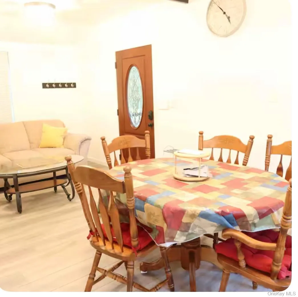 Dining space with wood finished floors Dining space with wood finished floors