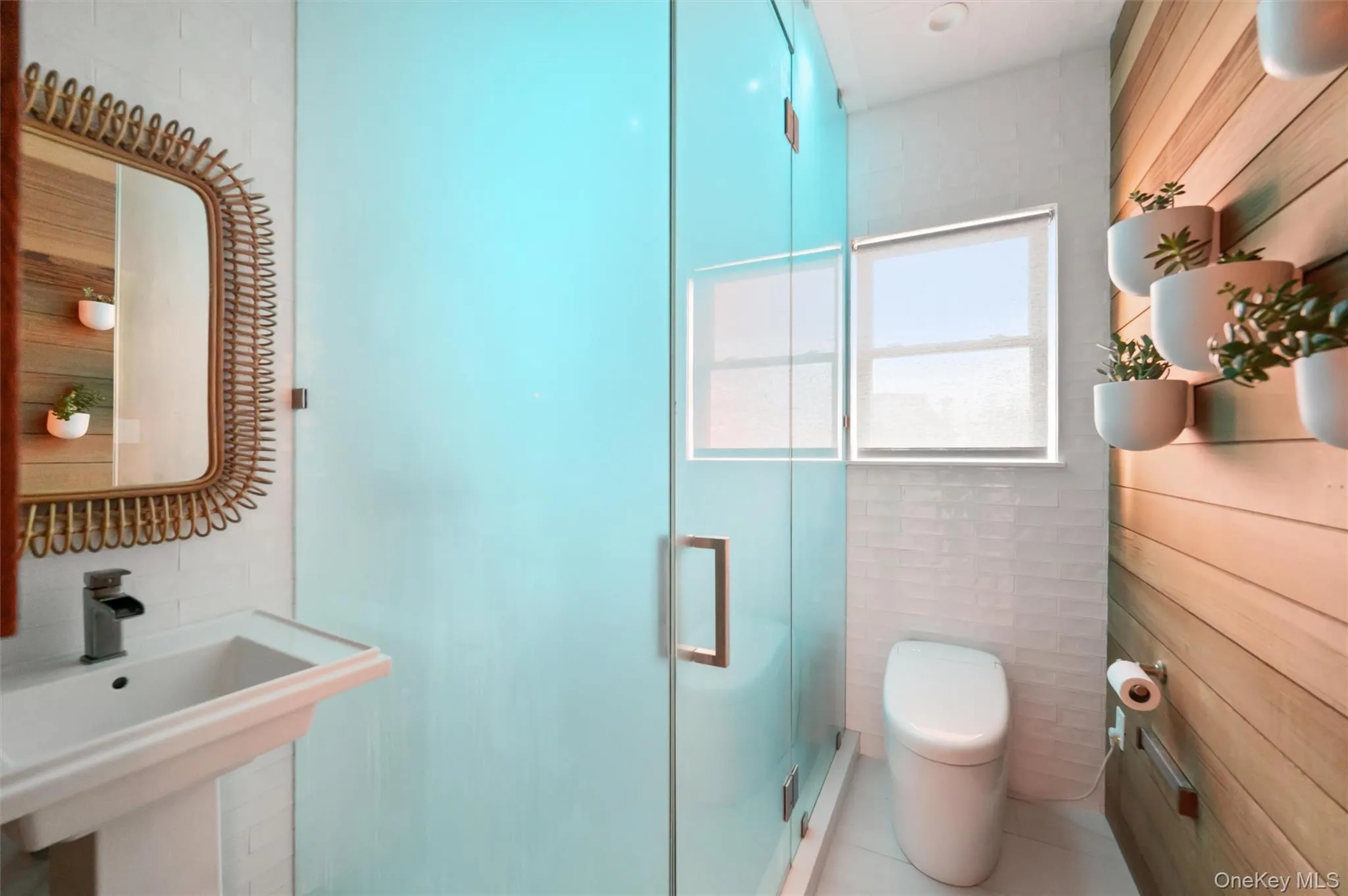 Bathroom featuring tile walls, a shower stall, and tile patterned flooring Bathroom featuring tile walls, a shower stall, and tile patterned flooring