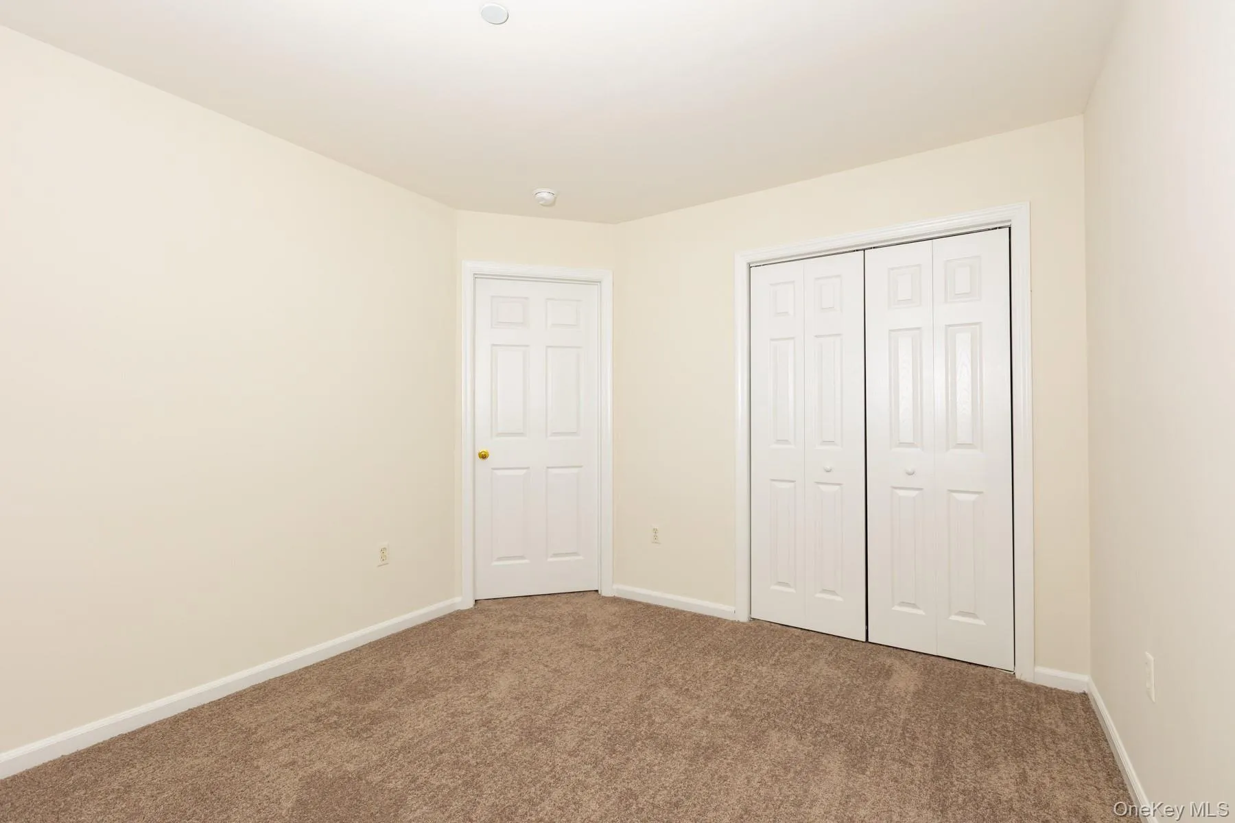 Unfurnished bedroom featuring carpet floors and a closet Unfurnished bedroom featuring carpet floors and a closet