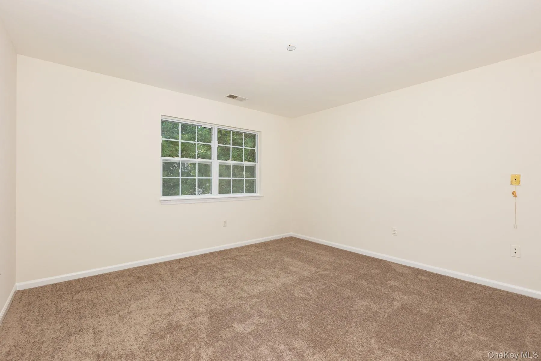 Spare room with baseboards and carpet floors Spare room with baseboards and carpet floors