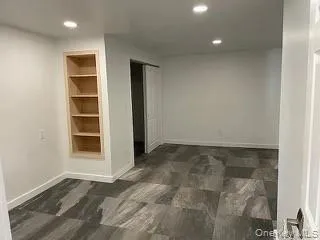 Bedroom with custom built-in shelving for extra storage or displaying your favorite items. Bedroom with custom built-in shelving for extra storage or displaying your favorite items.