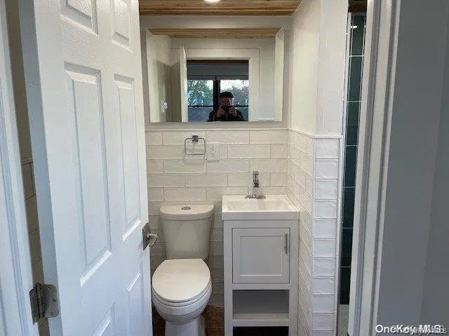 Stylish bathroom with tiled walls Stylish bathroom with tiled walls