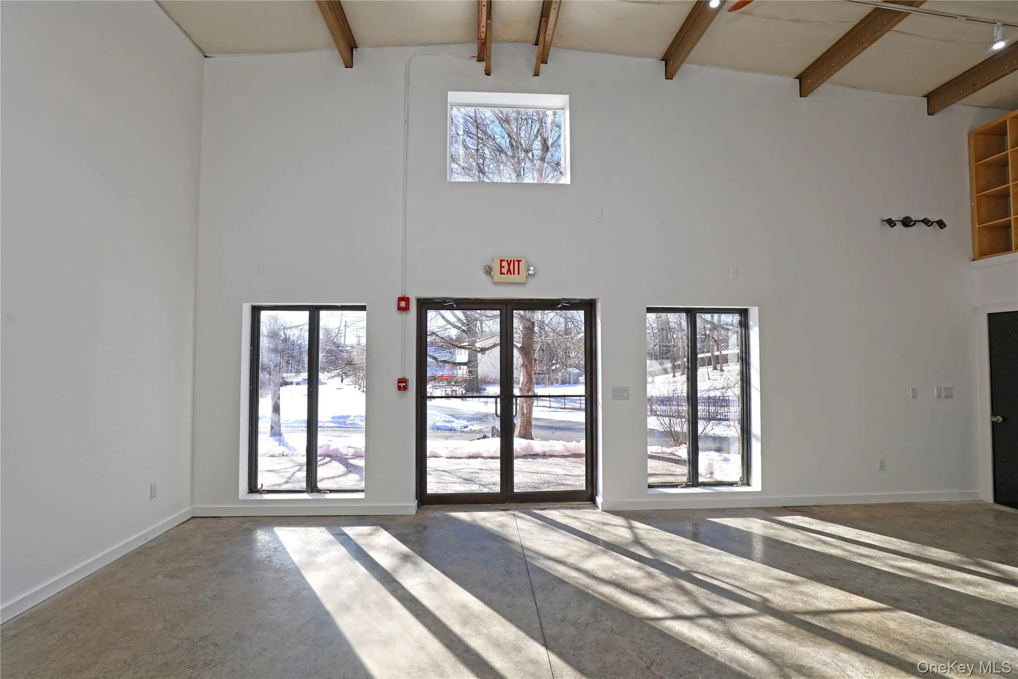 Common area with beam ceiling and a towering ceiling Common area with beam ceiling and a towering ceiling