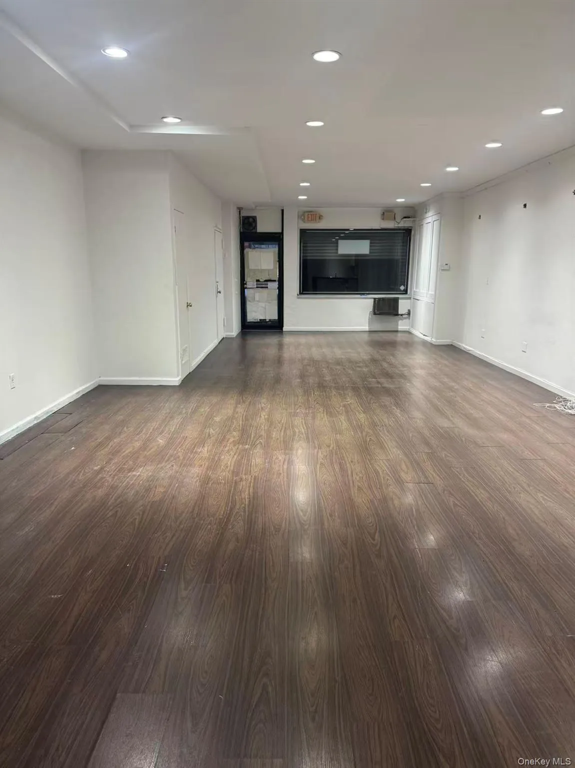 Unfurnished room with recessed lighting and wood finished floors Unfurnished room with recessed lighting and wood finished floors