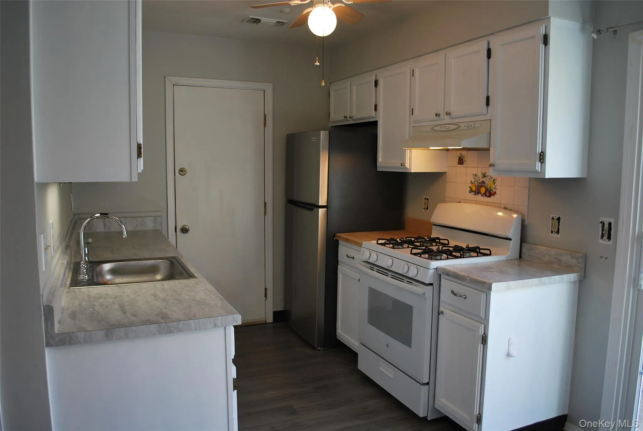 Kitchen door goes out to garage. Kitchen door goes out to garage.