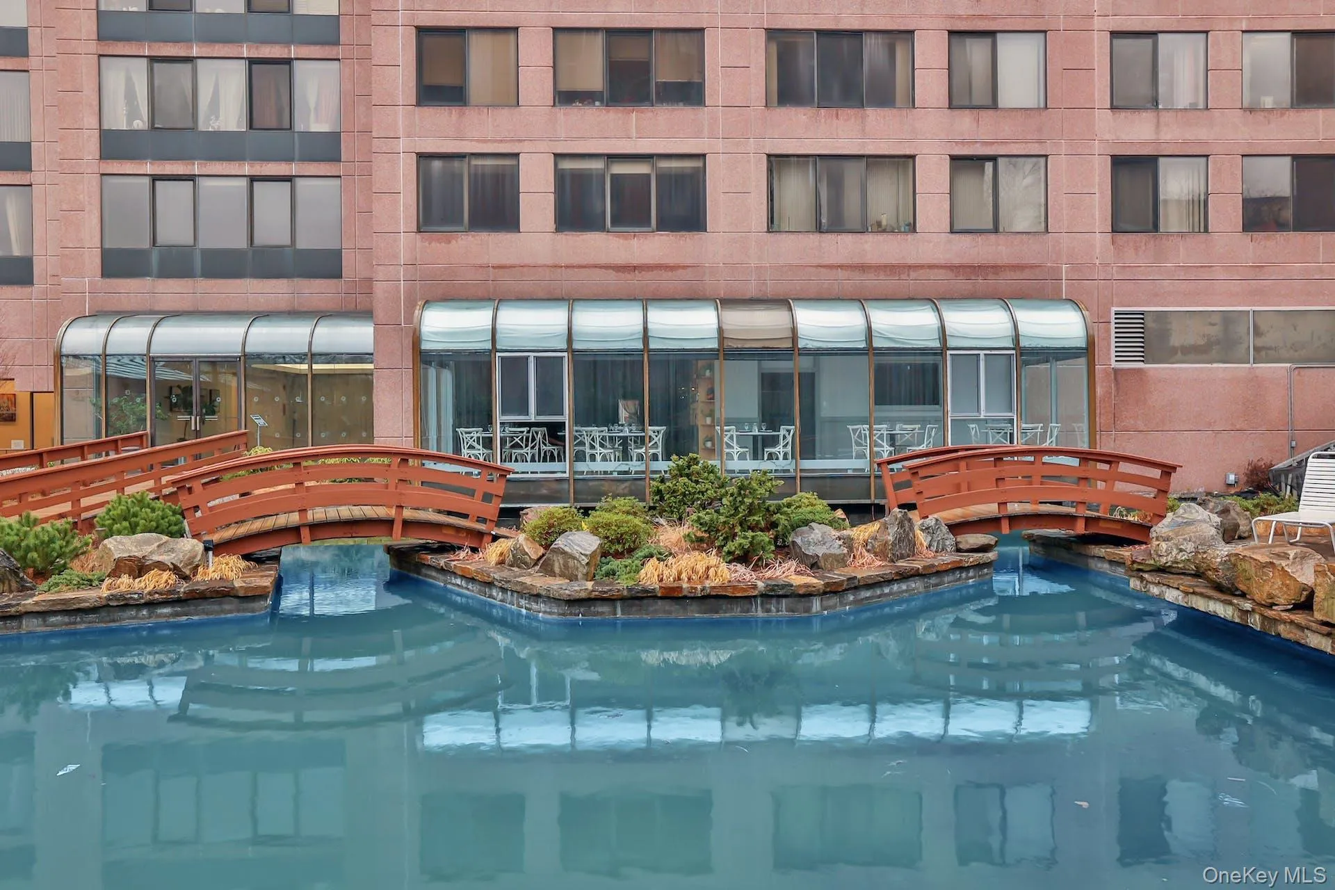 Back of building/ featuring pond and footbridges Back of building/ featuring pond and footbridges