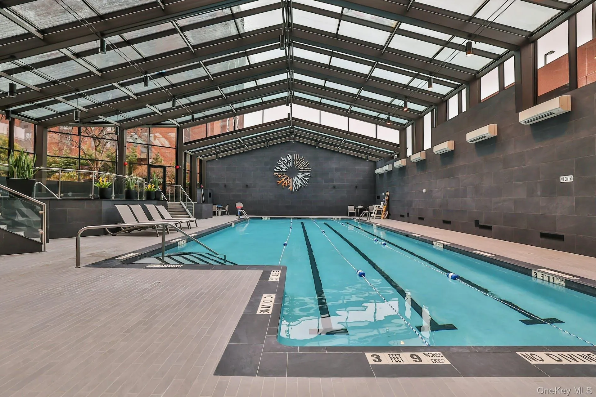 Indoor Olympic size heated pool with windowed enclosure Indoor Olympic size heated pool with windowed enclosure