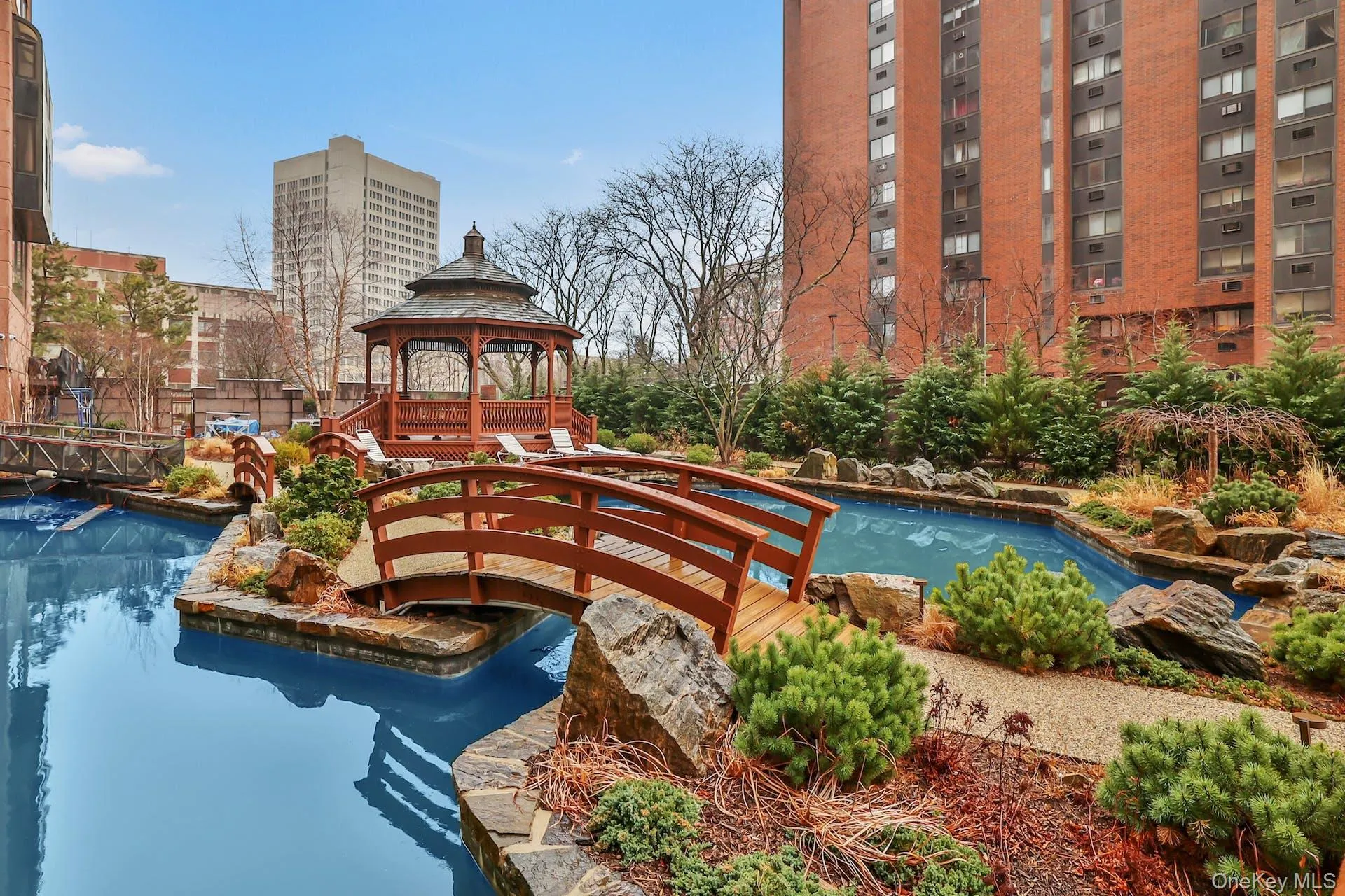 Pond/ footbridges/ landscaped garden and gazebo Pond/ footbridges/ landscaped garden and gazebo