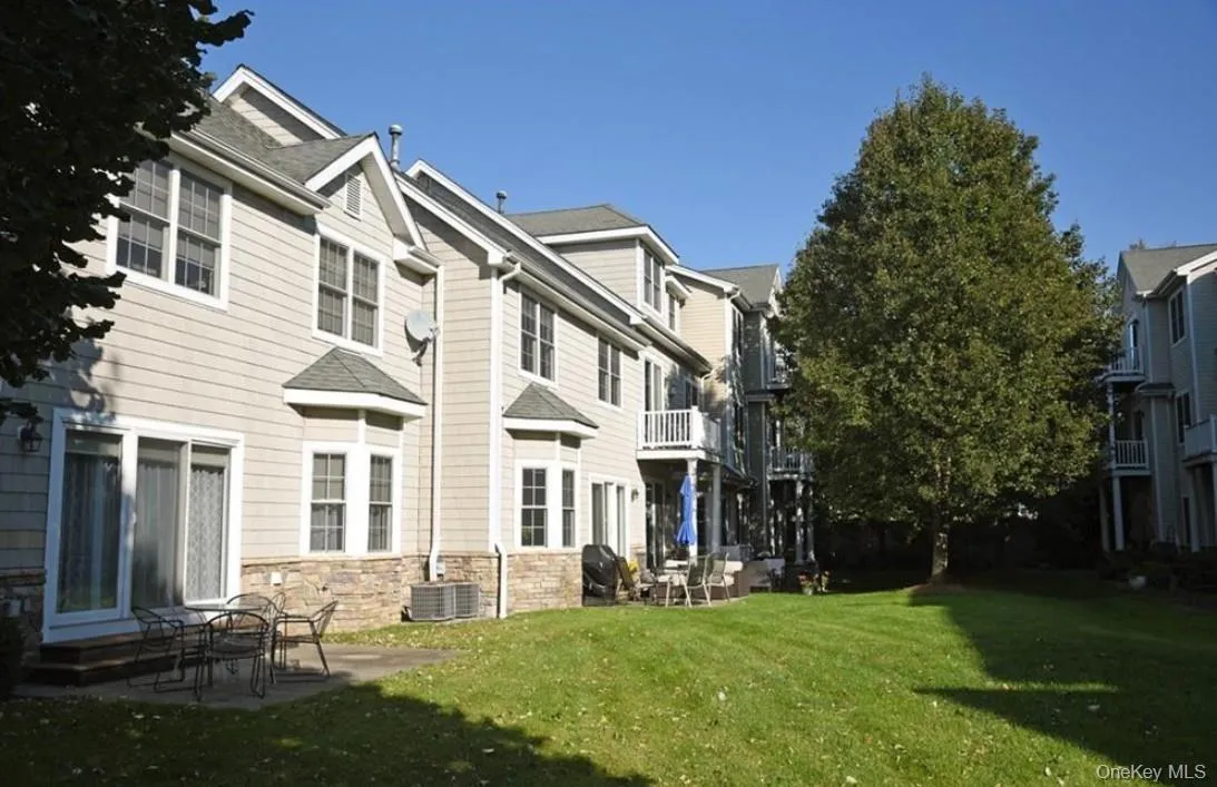 Sliding glass door off balcony provides view overlooking the common yard Sliding glass door off balcony provides view overlooking the common yard