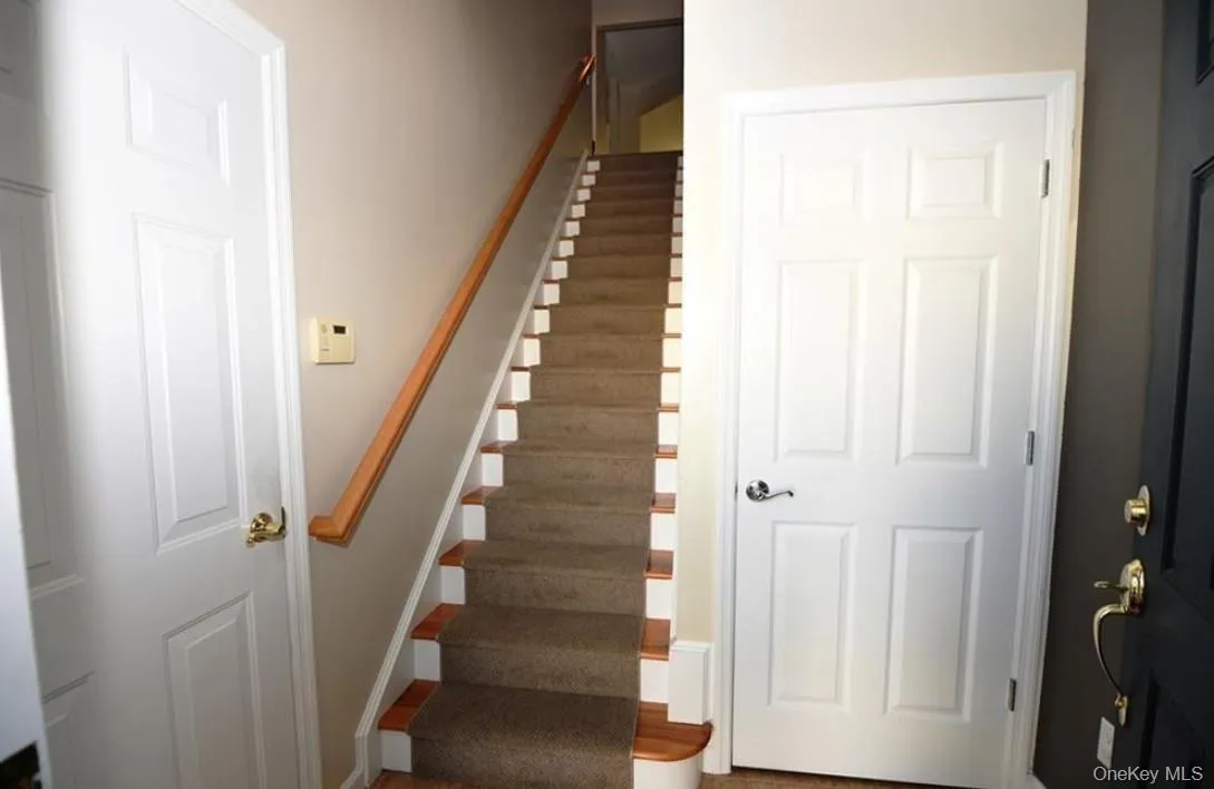 Entry to townhome with direct garage access and coat closet for your guests Entry to townhome with direct garage access and coat closet for your guests