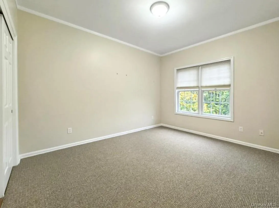 A generously sized main level bedroom with en suite bath offers flexibility for guests/home office/family A generously sized main level bedroom with en suite bath offers flexibility for guests/home office/family