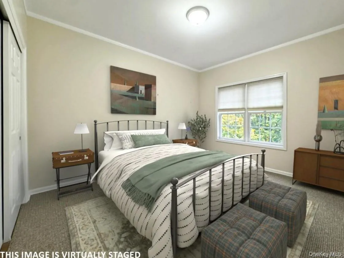 Virtually staged image of main level BR Virtually staged image of main level BR