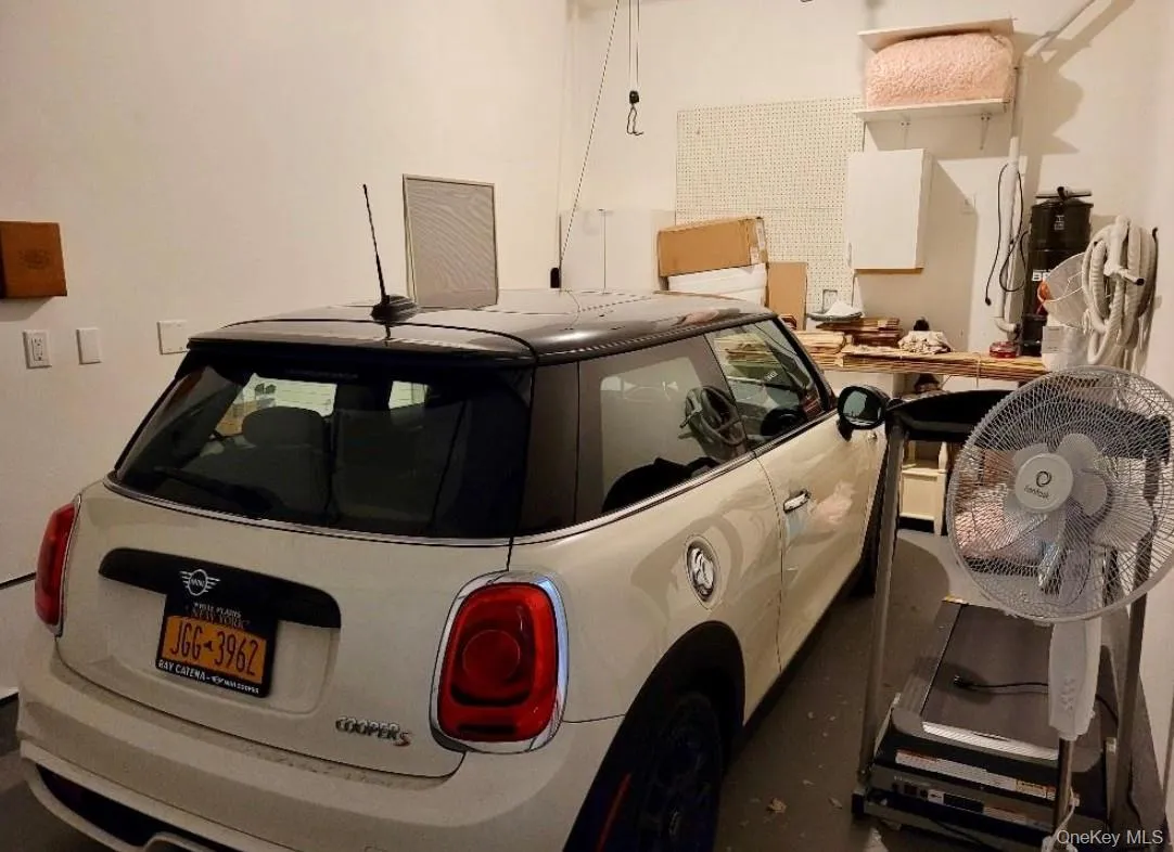 Attached one car garage with additional private parking space in front of the garage Attached one car garage with additional private parking space in front of the garage