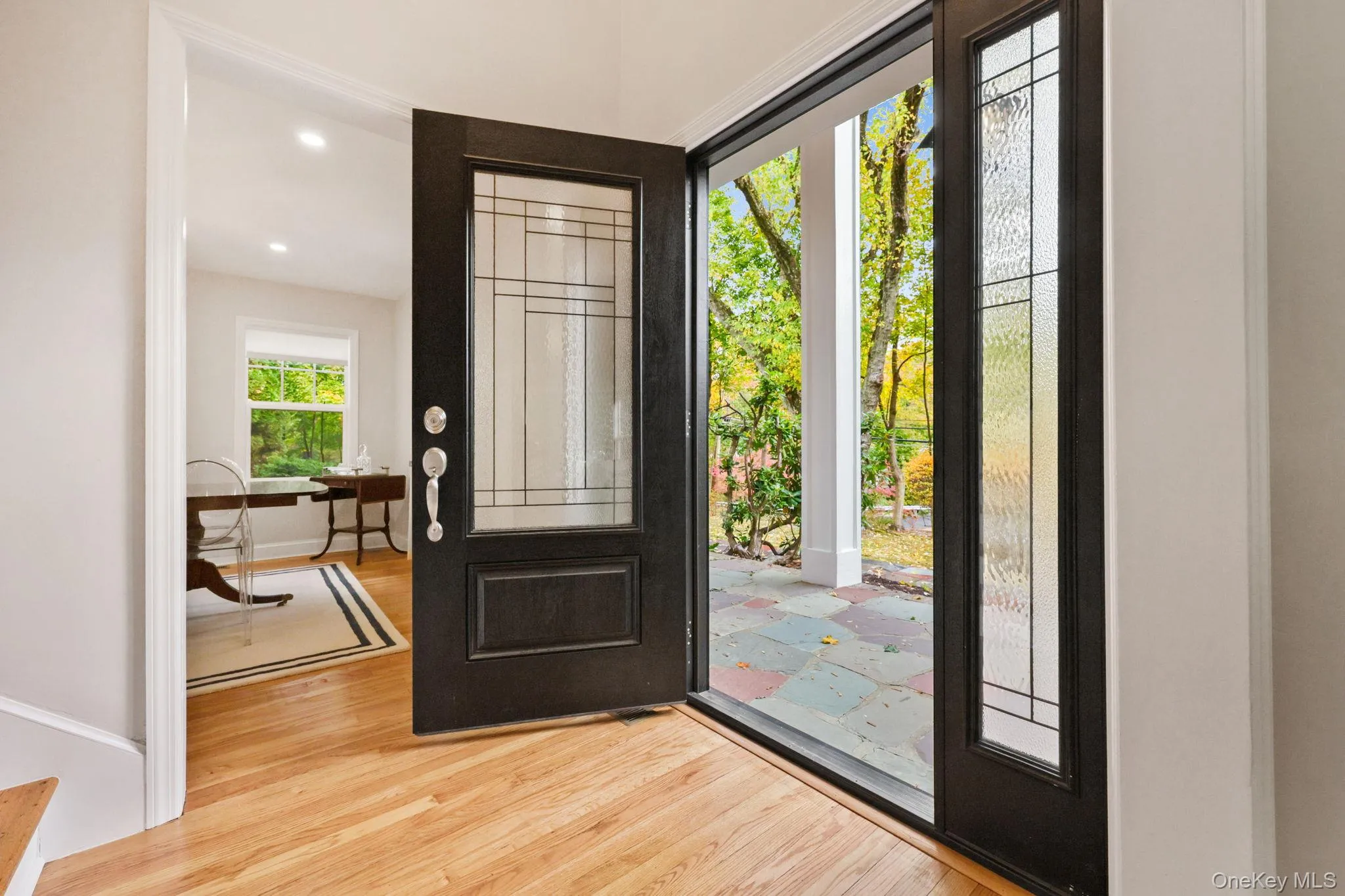 Entrance foyer with light wood finished floors and recessed lighting Entrance foyer with light wood finished floors and recessed lighting