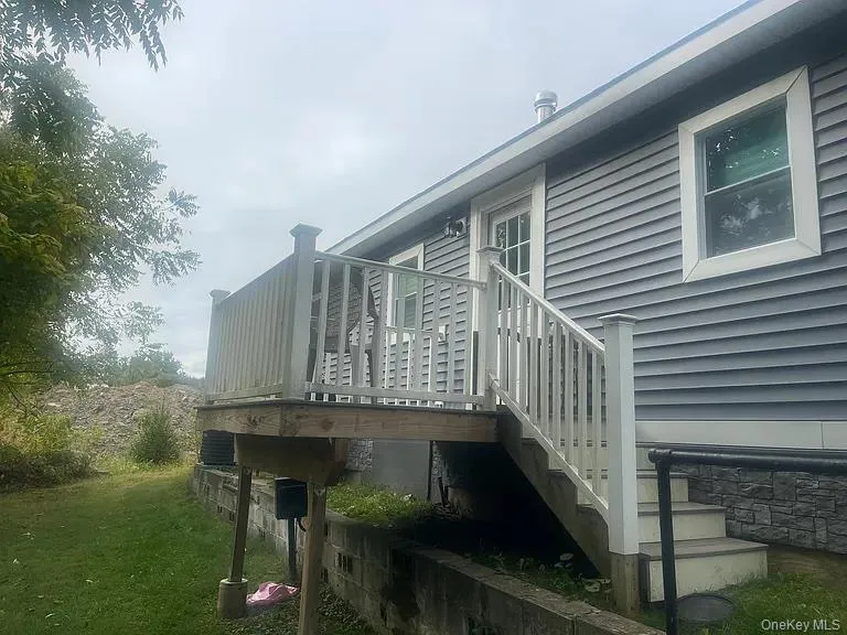 View of home's exterior featuring a deck View of home's exterior featuring a deck