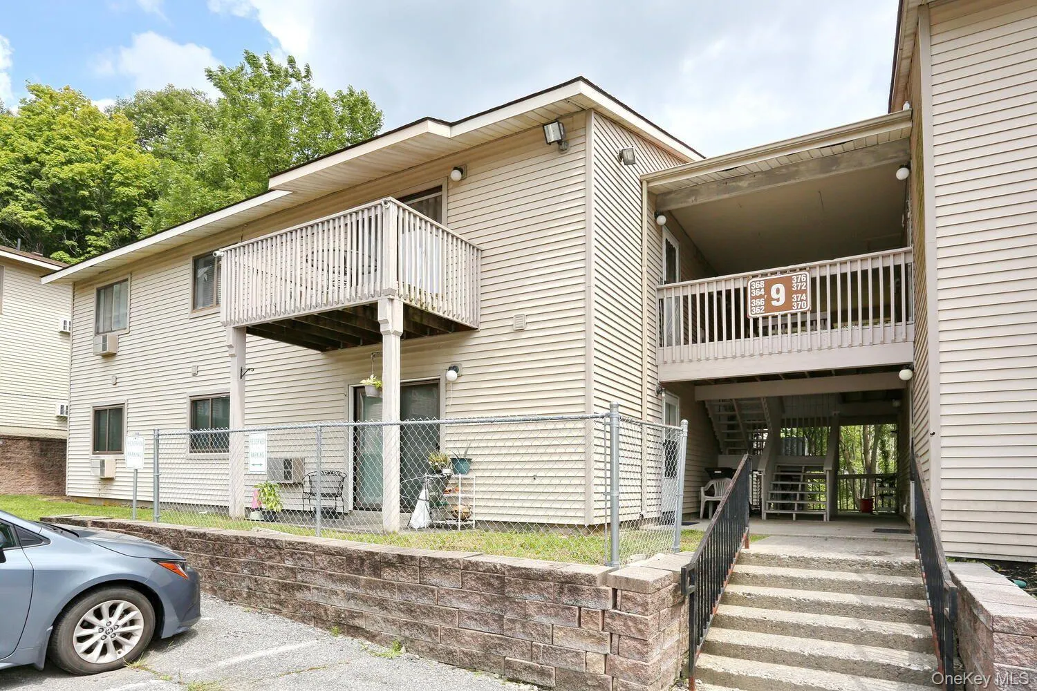 View of apartment building / complex with stairs View of apartment building / complex with stairs