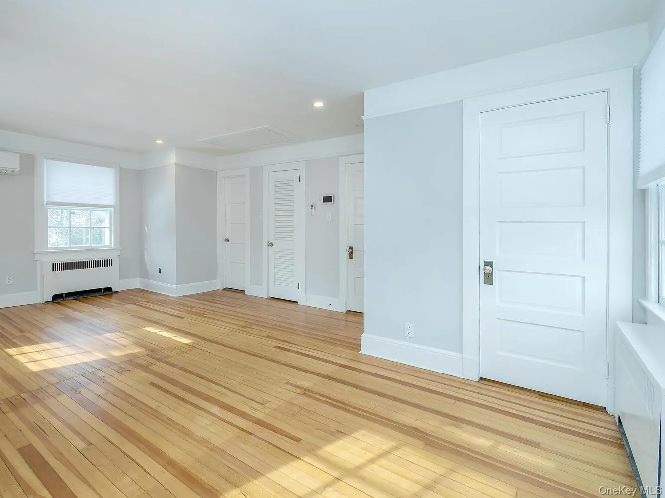 Primary Bedroom with Closet Systems and Newly Renovated Bathroom Primary Bedroom with Closet Systems and Newly Renovated Bathroom