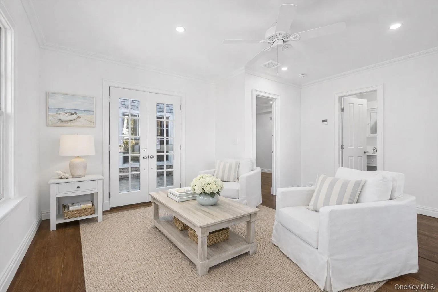 Living area with french doors, crown molding, dark wood-type flooring, ceiling fan, and recessed lighting Living area with french doors, crown molding, dark wood-type flooring, ceiling fan, and recessed lighting