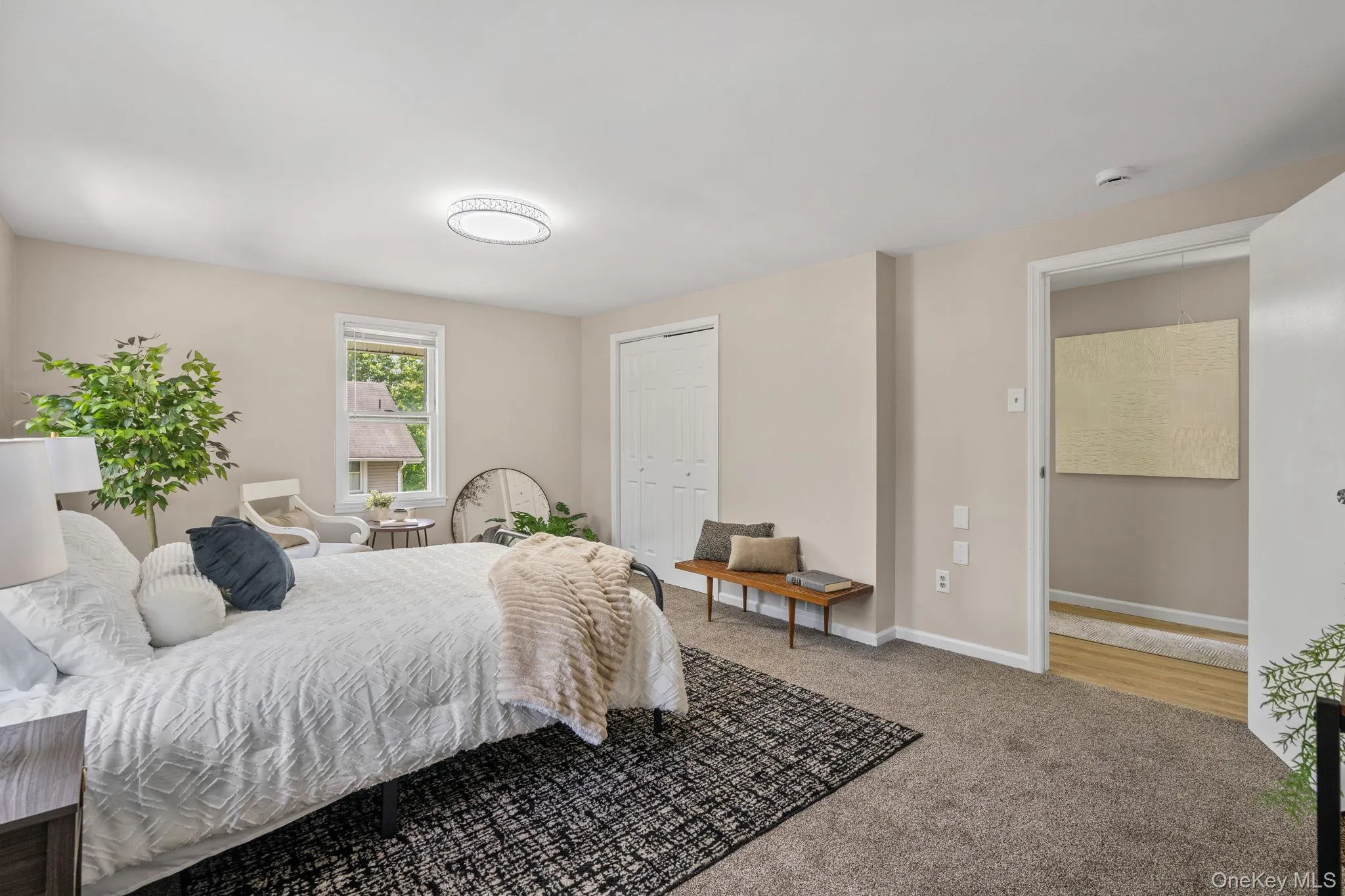 Bedroom featuring carpet flooring and a closet Bedroom featuring carpet flooring and a closet