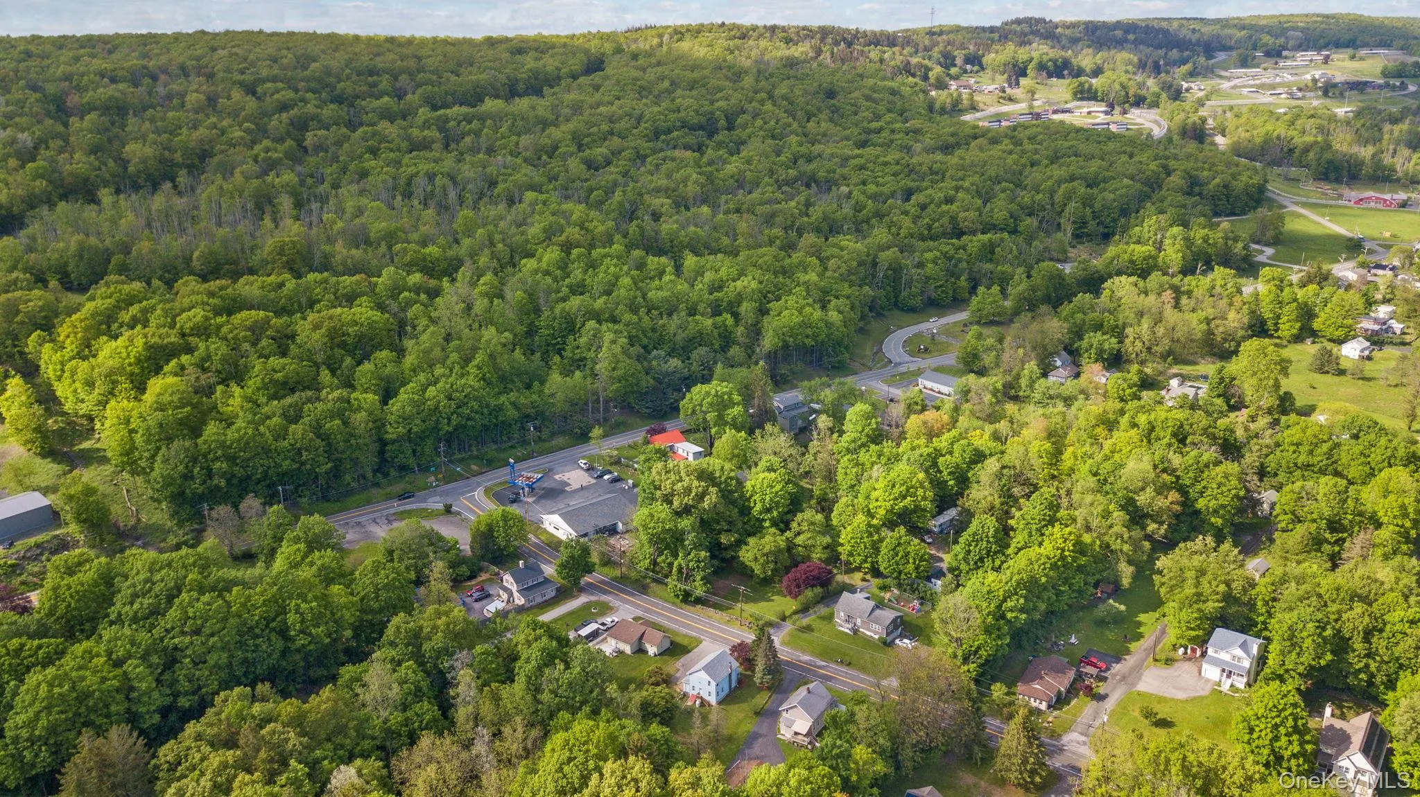 Aerial view of property's location with a heavily wooded area Aerial view of property's location with a heavily wooded area