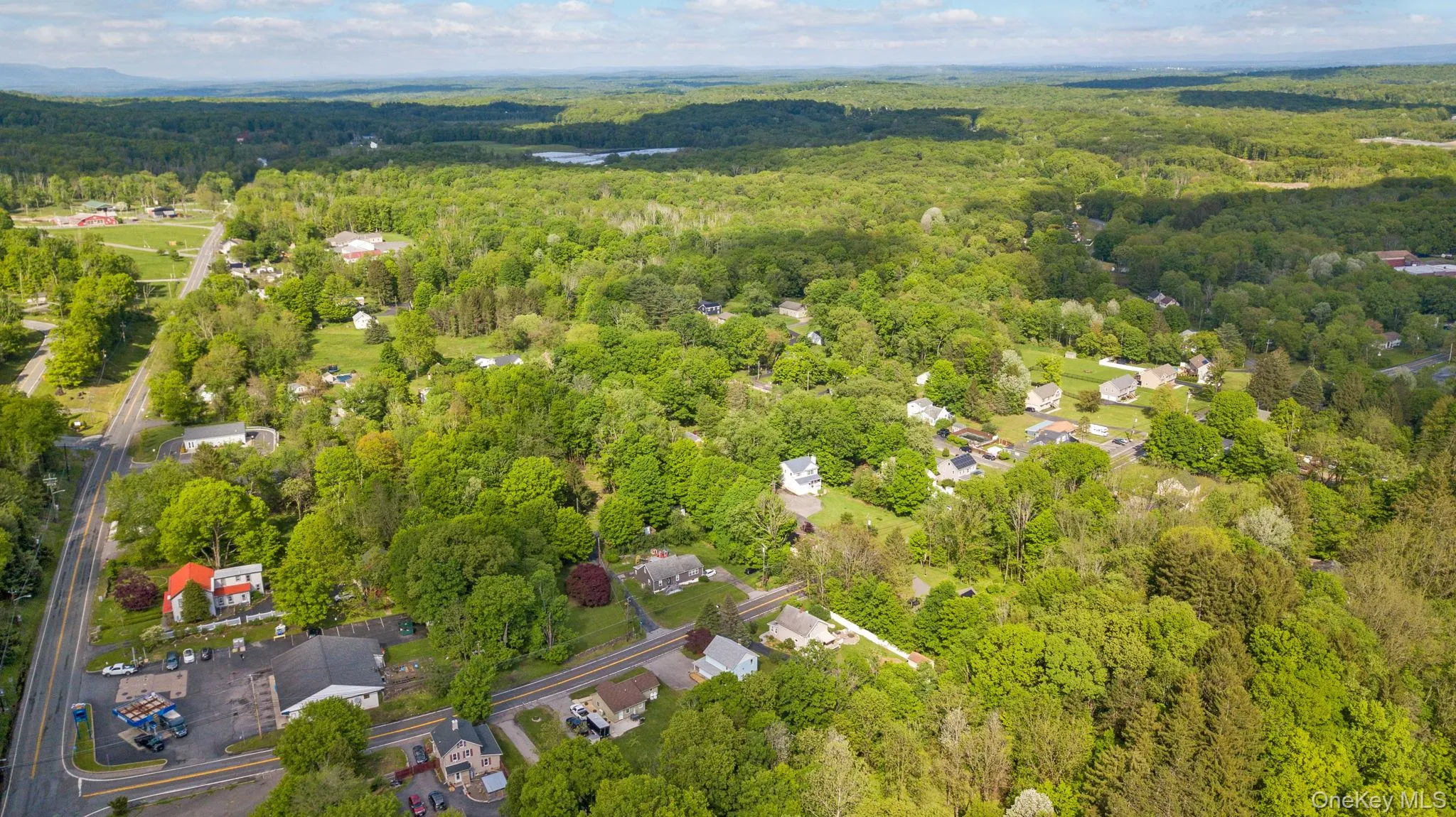 Aerial view of property's location featuring a heavily wooded area Aerial view of property's location featuring a heavily wooded area